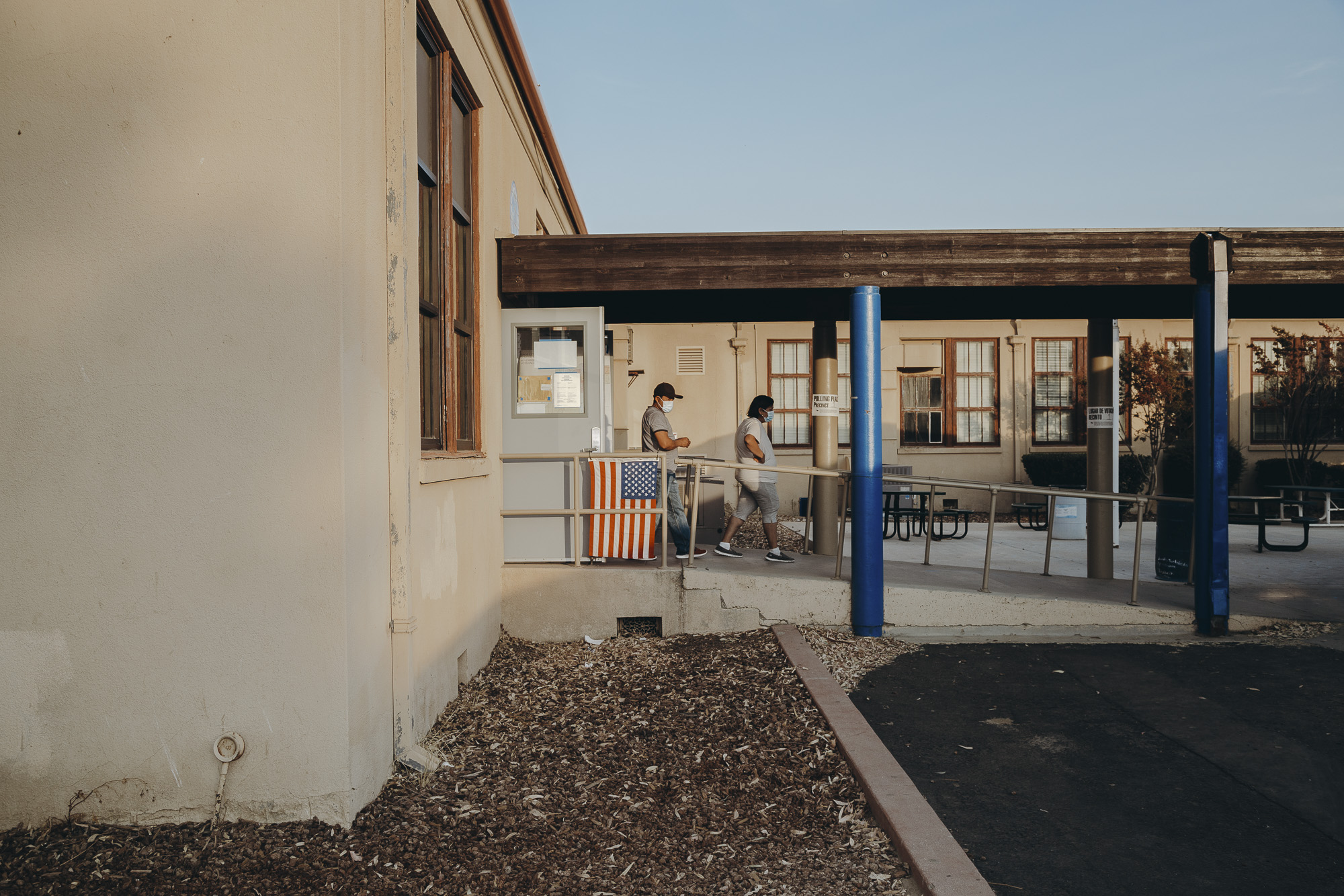 Voters exit Avenal High School in Kings County on November 3, 2020. Photo by Clara Mokri for CalMatters