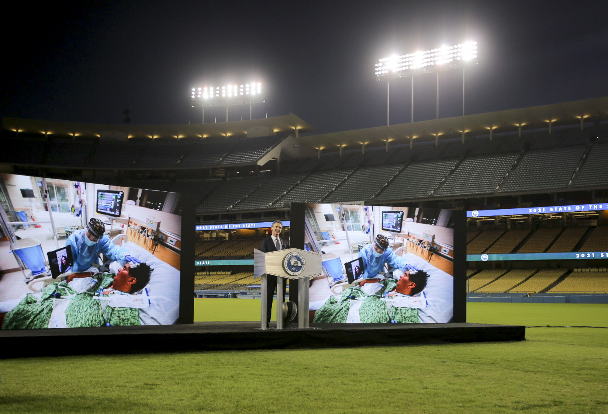 Gov. Gavin Newsom talks of the state's pandemic response and hopes for an end in site during the State of the State address at Dodger Stadium on March 9, 2021. Photo by Shae Hammond for CalMatters