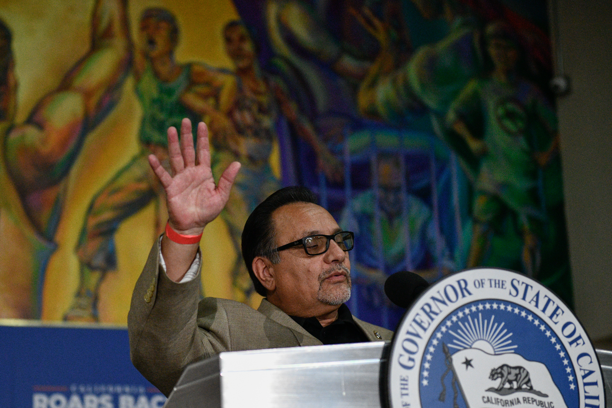 Ron Herrera, executive director of the Hispanic Caucus, delivers a speech during a rally for Gov. Gavin Newsom in El Sereno, on July 13, 2021. Photo by Pablo Unzueta for CalMatters