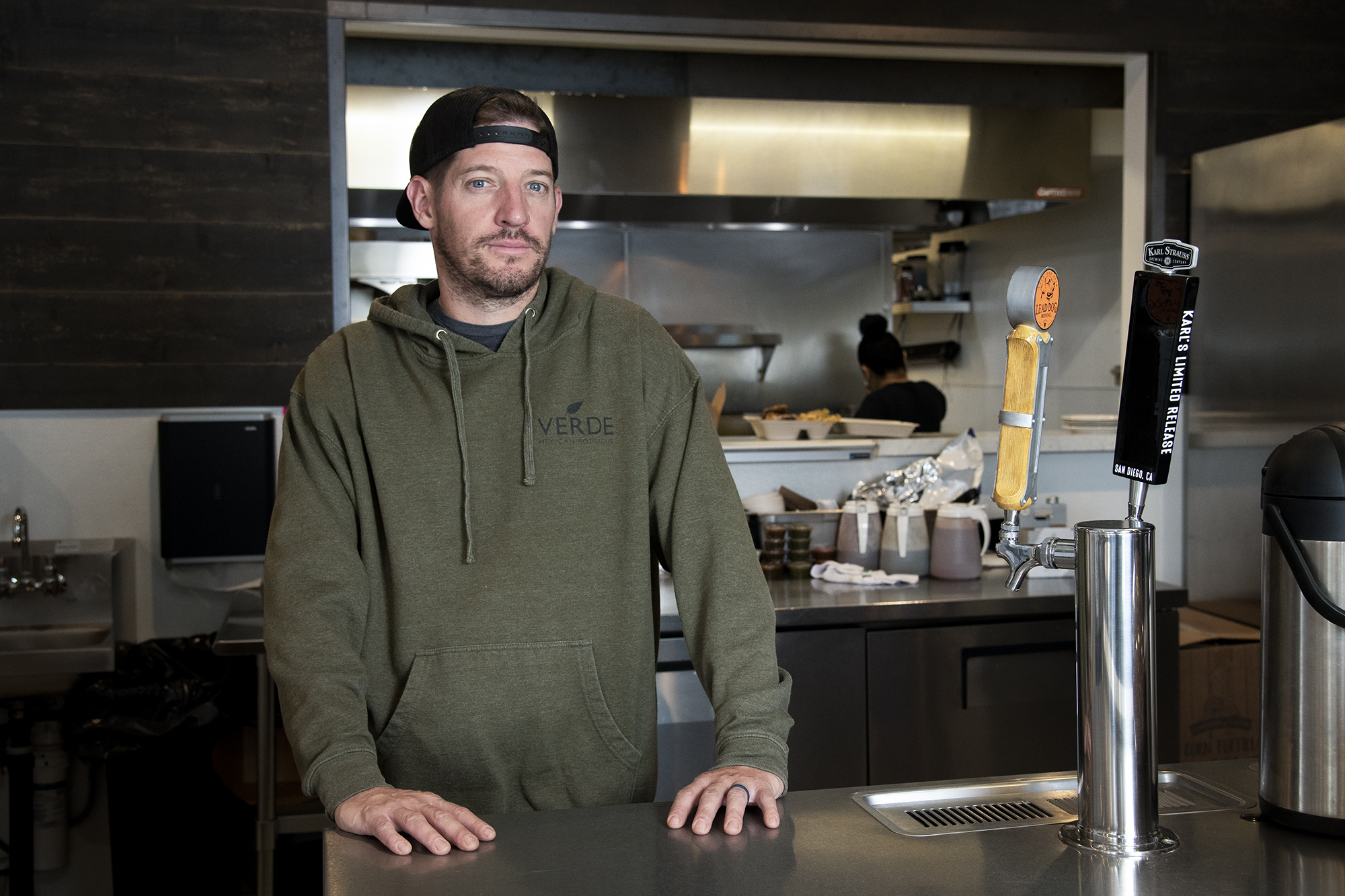 Domi Chavarria poses for a portrait at his restaurant Verde Mexican Rotisserie in South Lake Tahoe on Oct. 6, 2021. Domi Chavarria, the owner of Verde Mexican Rotisserie, lost about $10K worth of inventory when they shut down for two weeks due to the Caldor Fire evacuation. Salgu Wissmath for CalMatters