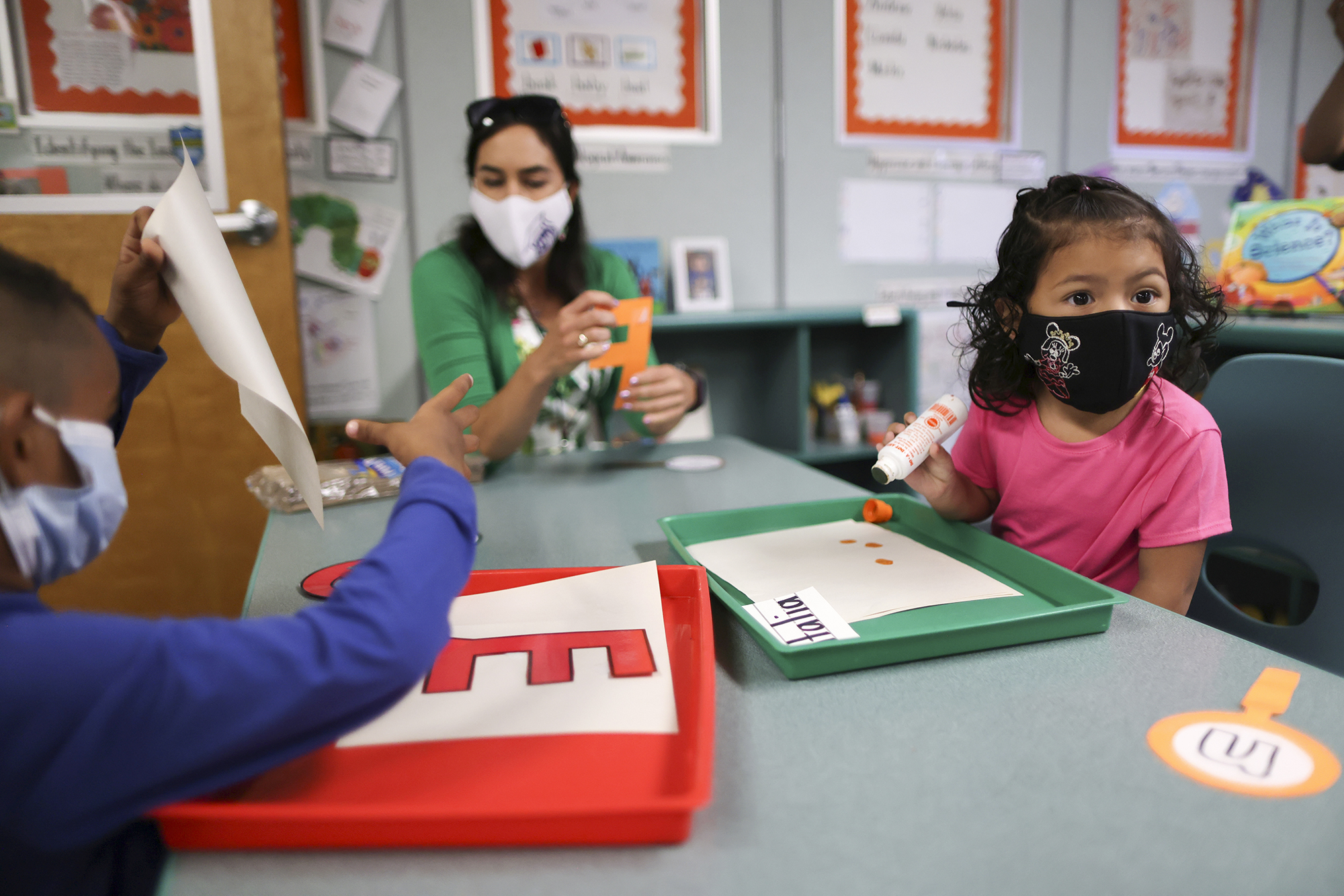 LAUSD Board Member Tanya Ortiz Franklin helps students on the first day back at school for LAUSD students following the COVID-19 remote school period in Los Angeles on Aug. 16, 2021. Photo by Lucy Nicholson, Reuters