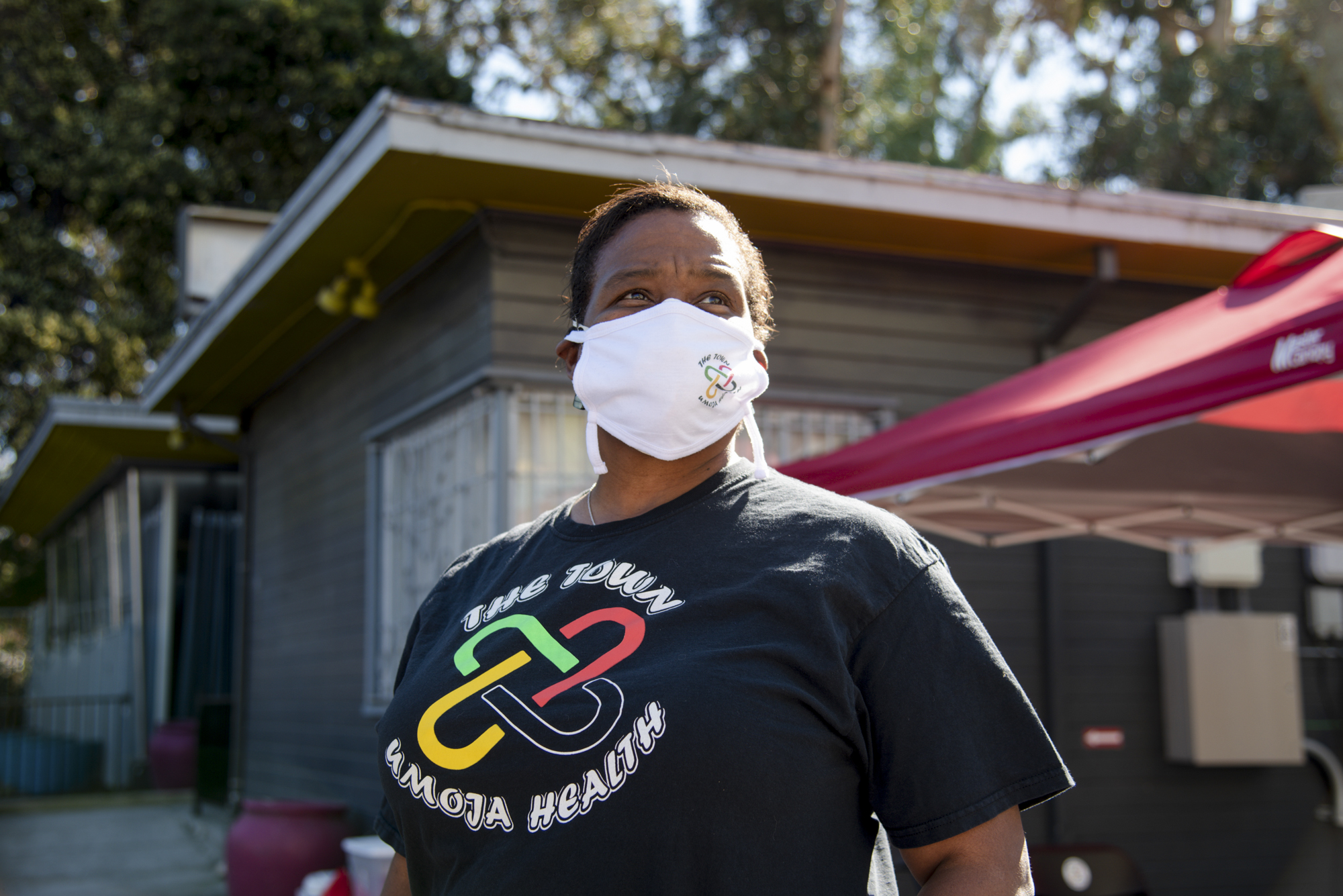 Dr. Kim Rhoads poses for a portrait outside the Umoja Health pop-up clinic in Oakland on Thursday, February 17, 2022. Dr. Rhoads works with Umoja Health to help vaccinate Black community members against COVID-19. Photo by Marissa Leshnov for CalMatters