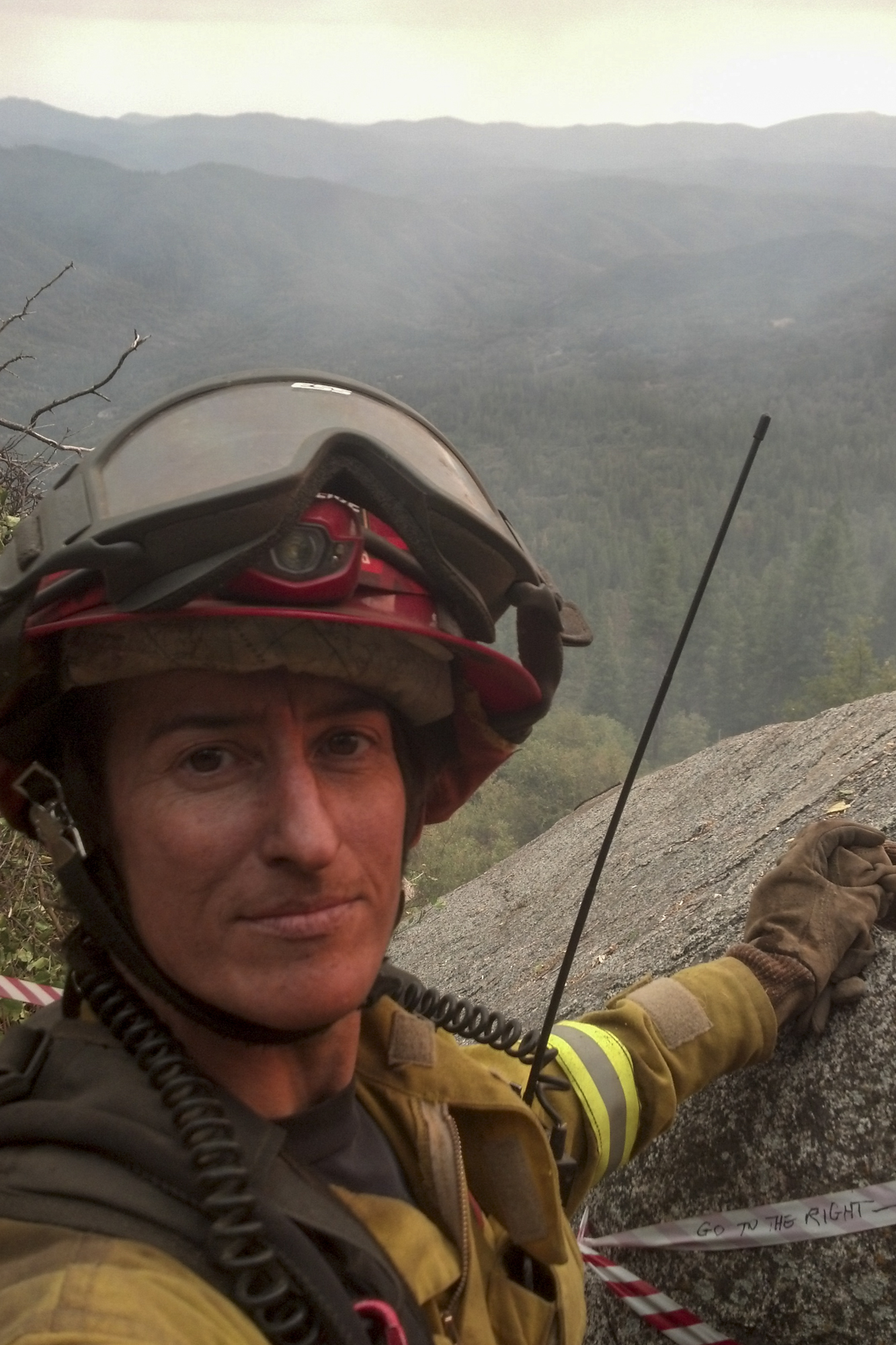 Noelle Bahnmiller poses for a photo while assigned as a Heavy Equipment Boss (Trainee) on the Rim Fire, in Yosemite and the Stanislaus National Forest on Aug. 31, 2013. Photo courtesy of Noelle Bahnmiller