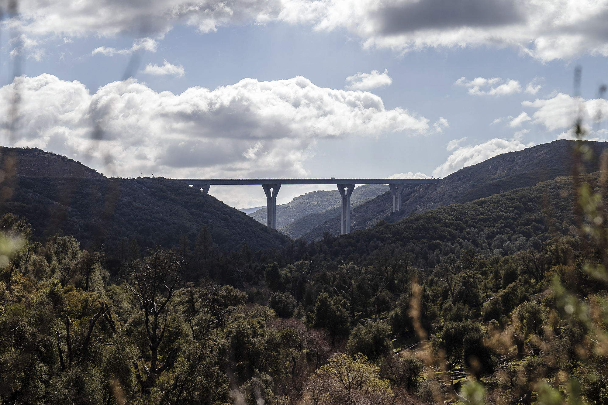 View of Pine Valley Creek Bridge formally known as the Nello Irwin Greer Memorial Bridge from Pine Creek Trailhead outside of Pine Valley, Ca on March 10, 2022. Photo by Ariana Drehsler for CalMatters