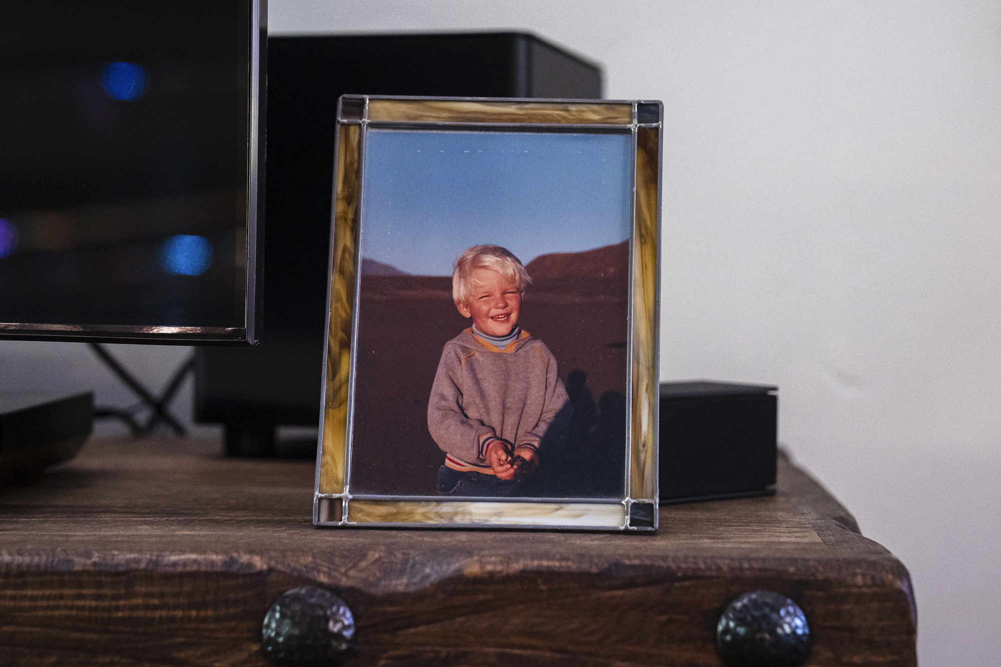 A picture of Ryan Mitchell in Baja California when he was between 4 and 5 years old in the living room of William and Leslie Mitchell in Lakeside, California on February 10, 2022. Photo by Ariana Drehsler for CalMatters