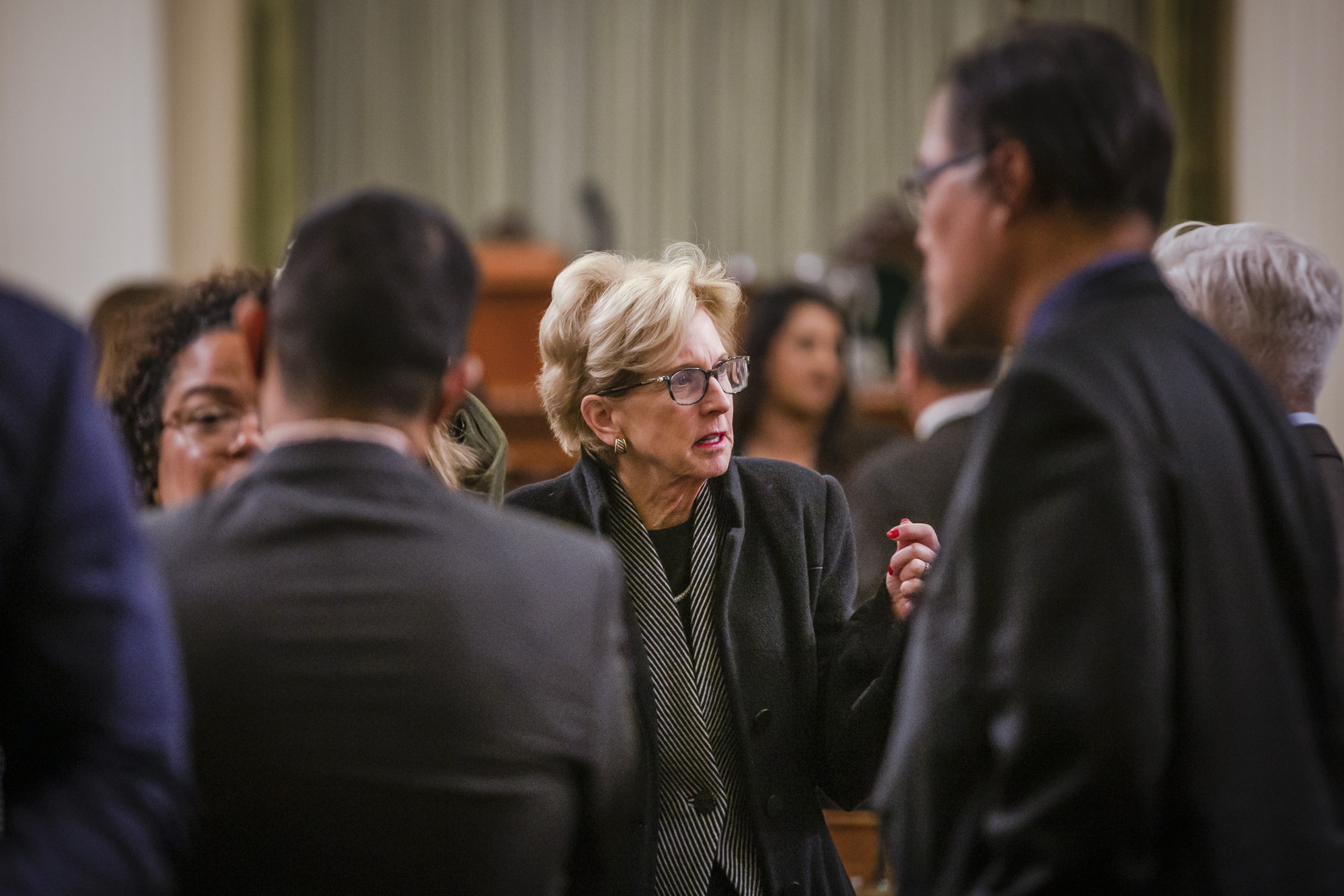 Assemblymember Diane Dixon, a Newport Beach Republican, talks with fellow legislators on the Assembly floor on Jan. 4, 2023.