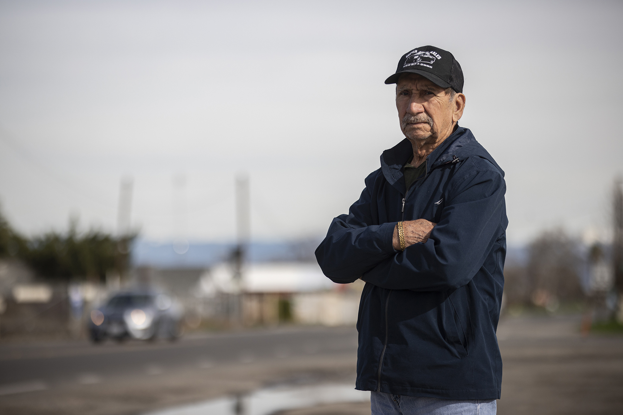 Madera resident Pedro Dominguez, 80, stands near a busy street in town on Jan. 12, 2023.