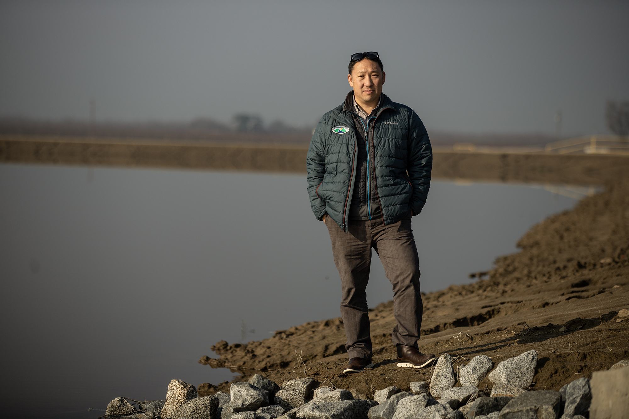 Tulare Irrigation District General Manager Aaron Fukuda stands near the Cordeniz basin outside Tulare on Jan. 26, 2023.
