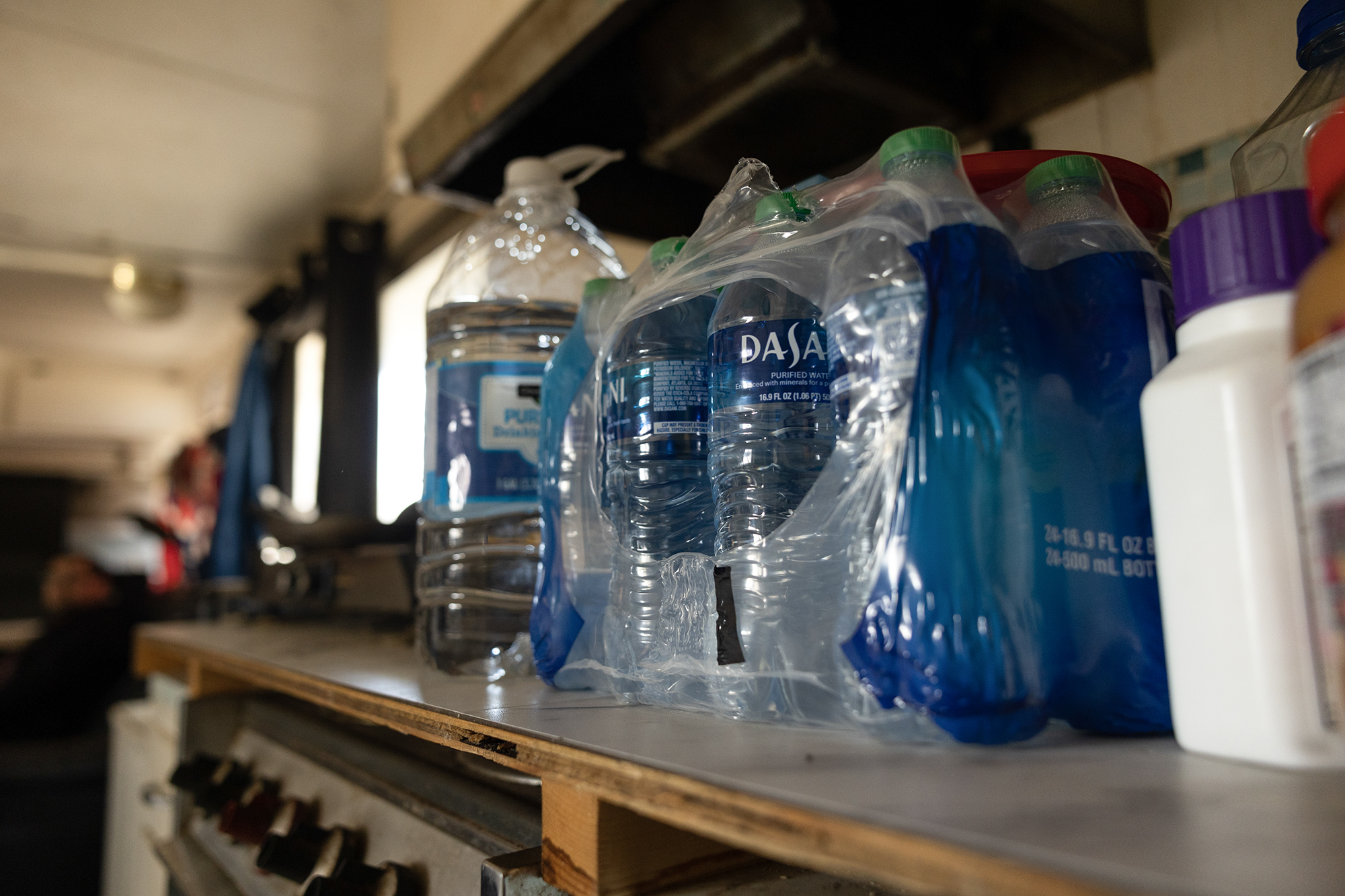 Bobby Riley has been relying on bottled water for drinking and washing dishes, as Stockton Park Village currently doesn't provide those services. Jan. 27, 2023.