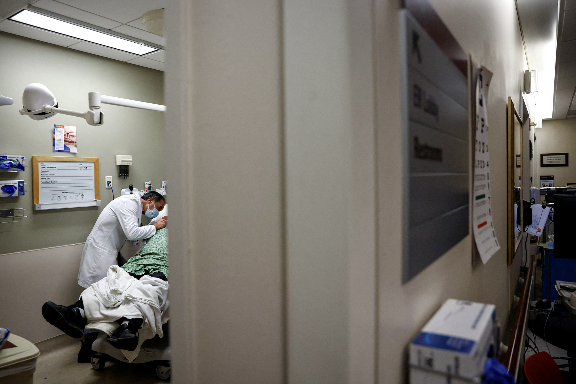 A doctor treats a patient at Providence Mission Hospital in Mission Viejo on Jan. 27, 2022. Photo by Shannon Stapleton, Reuters