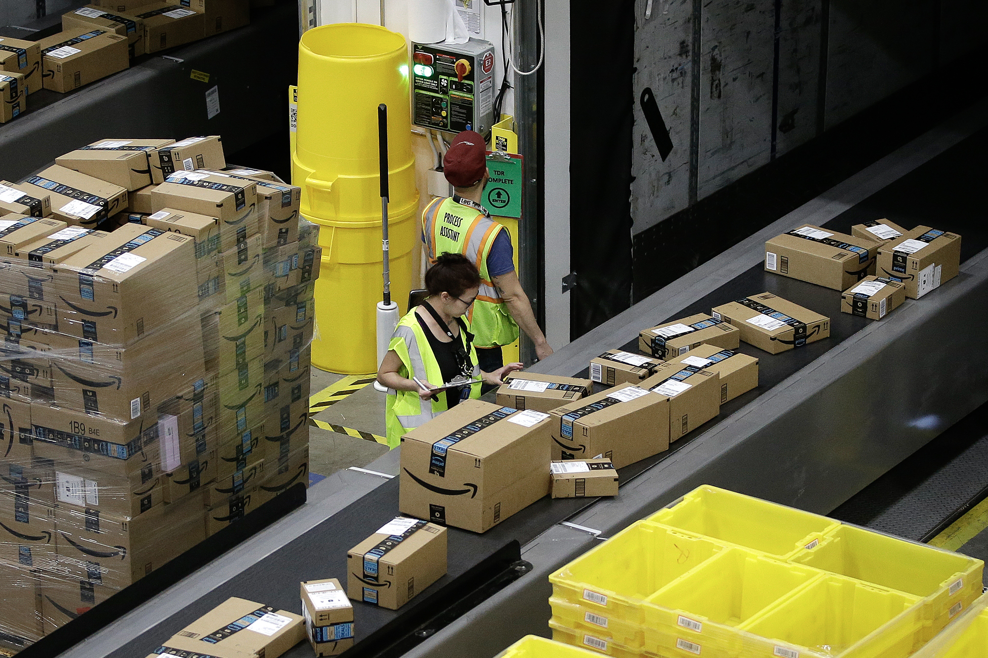 Packages move down a conveyor system at an Amazon Fulfillment Center in Sacramento on Feb. 9, 2018. Photo by Rich Pedroncelli, AP Photo