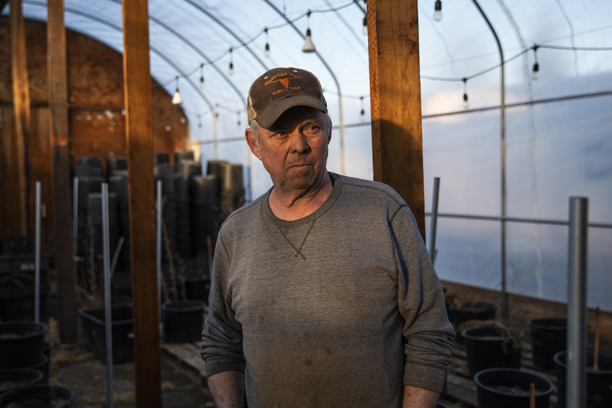 Scott Murrison inside a hoop house full of unused cannabis growing equipment in Hayfork on Feb. 7, 2023.