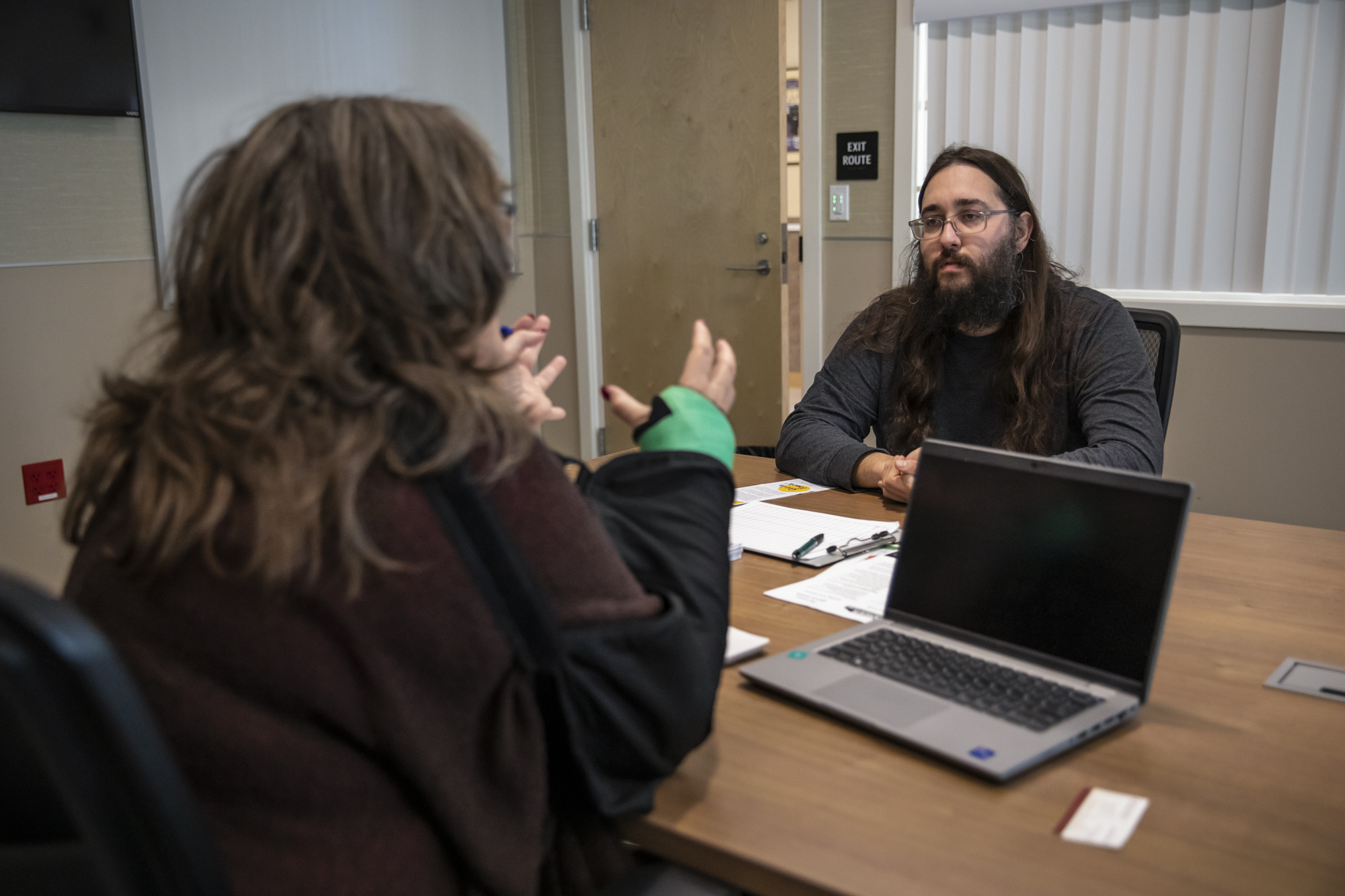 Daniel Rivero (right) listens as Leann Greene talks to him about finding job opportunities outside of the cannabis industry through a program with the Humboldt Workforce Coalition at the Humboldt County Library in Garberville on Feb. 8, 2023.