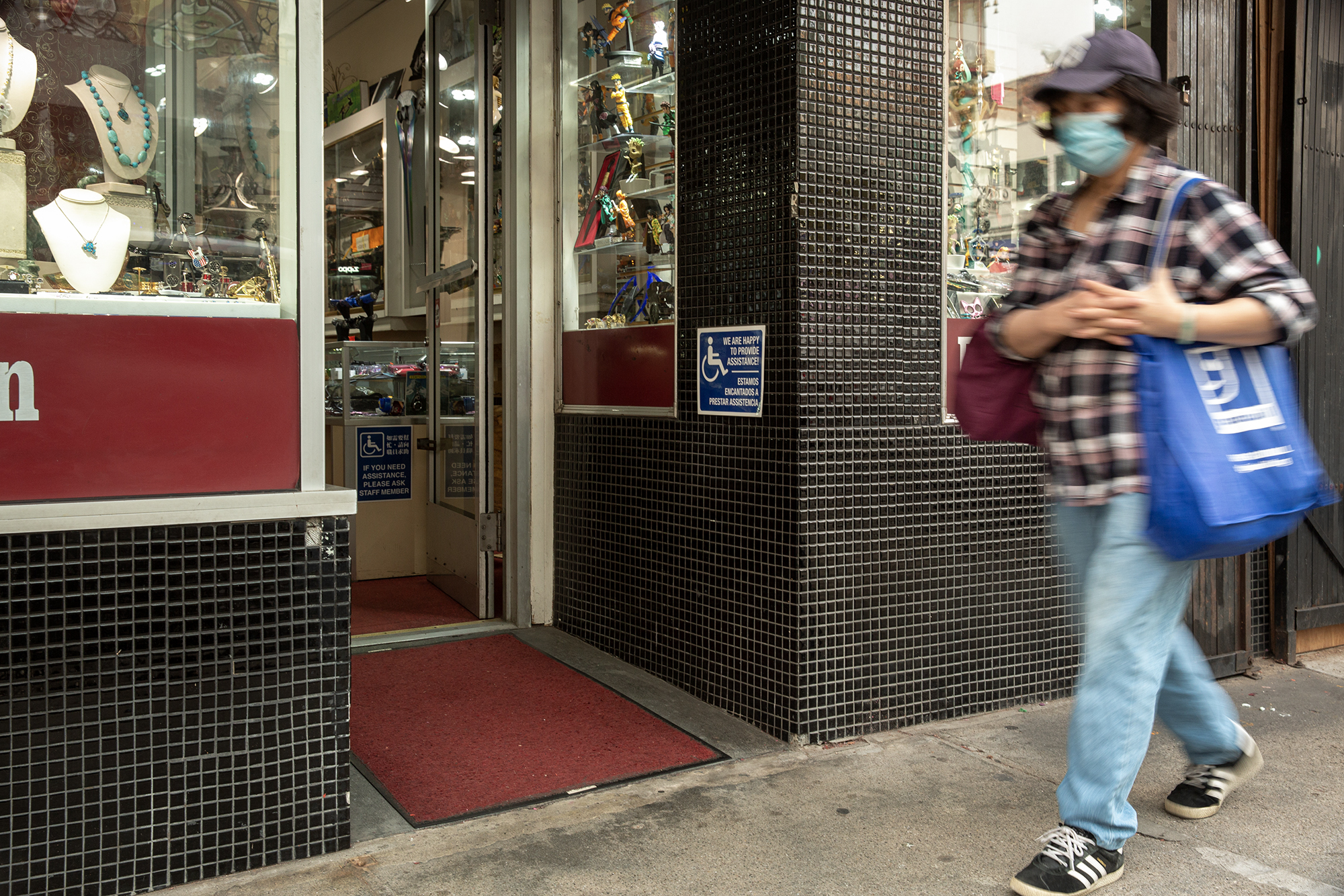 An accessibility sign at the entrance of a business in Chinatown, San Francisco on Feb. 18, 2023.