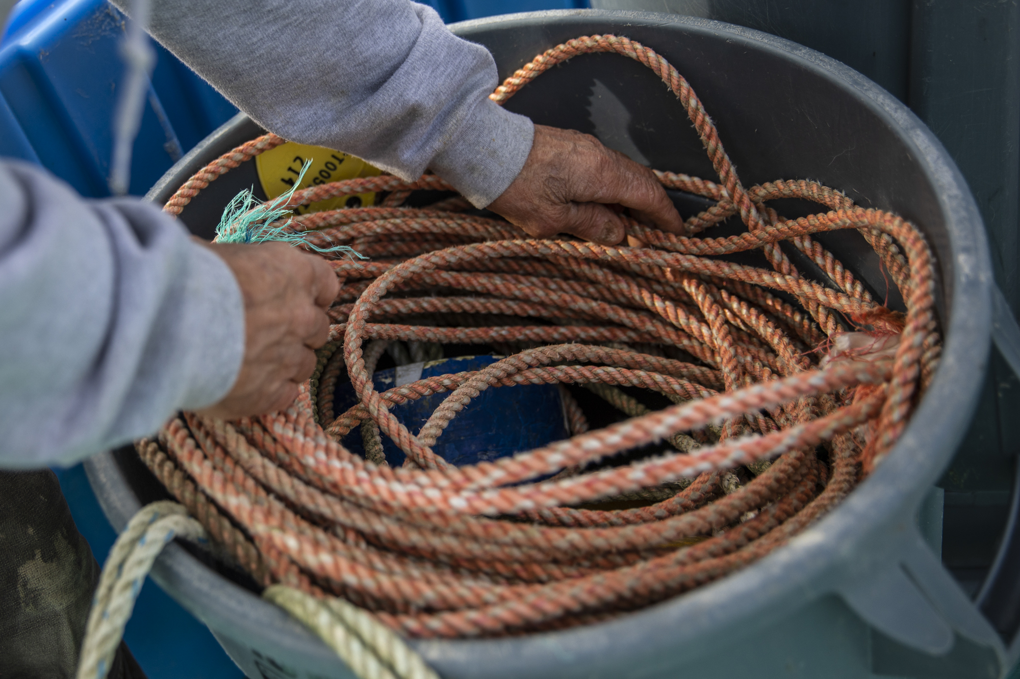 Fisherman Dick Ogg stows rope aboard his boat, the Karen Jeanne, in Bodega Bay on Mar. 3, 2023.
