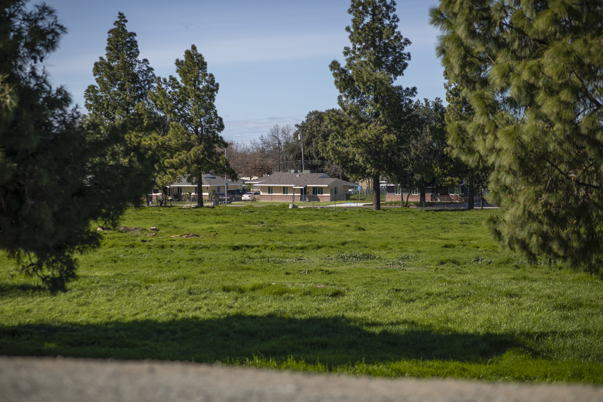 Homes in the Van Buskirk neighborhood of Stockton sit below the East San Joaquin River Levee on March 25, 2023.