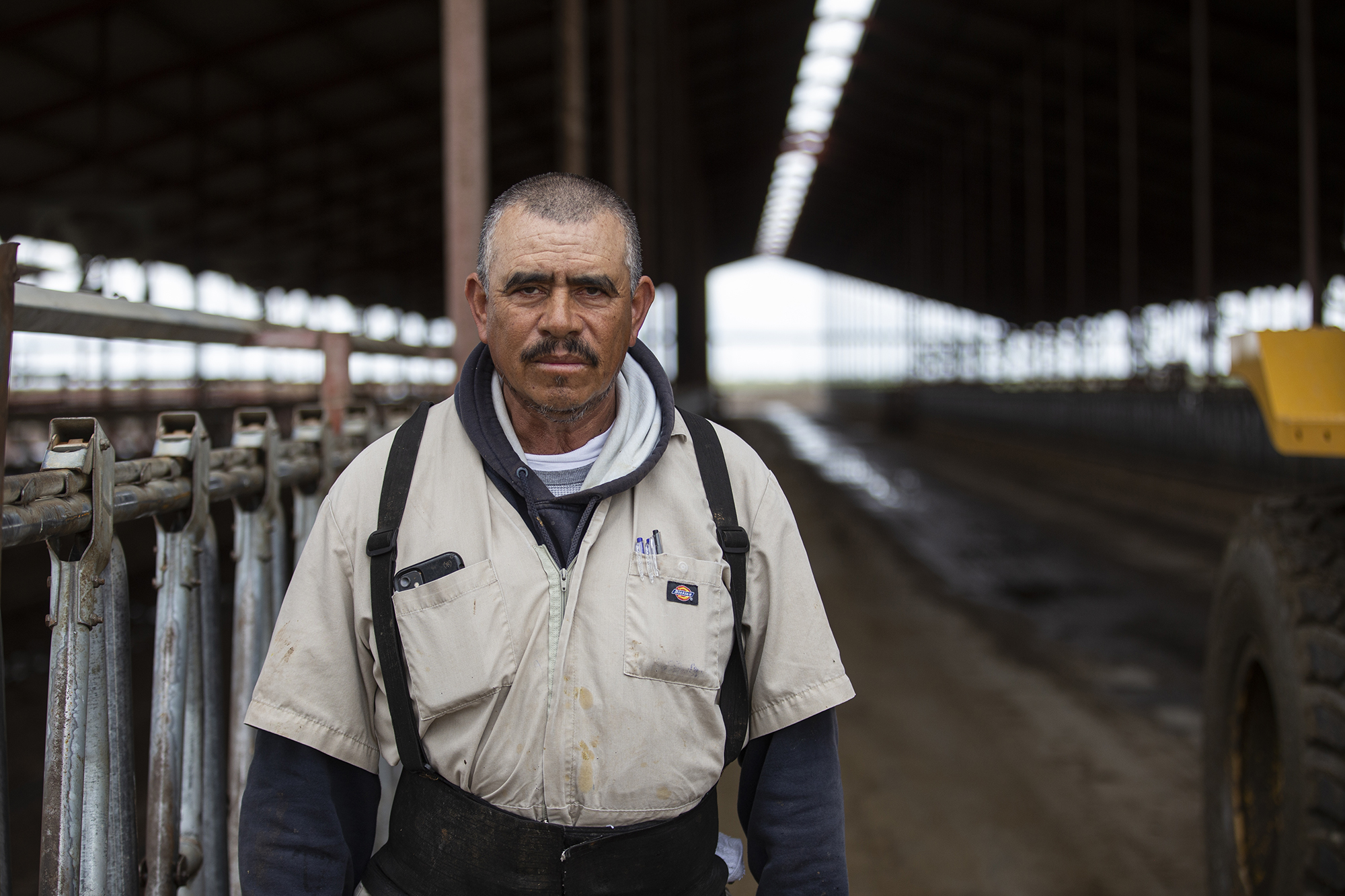 Roberto Martinez, a long-time employee of Lerda-Goni Farms, stands in the empty cow stalls on the farm on March 23, 2023.