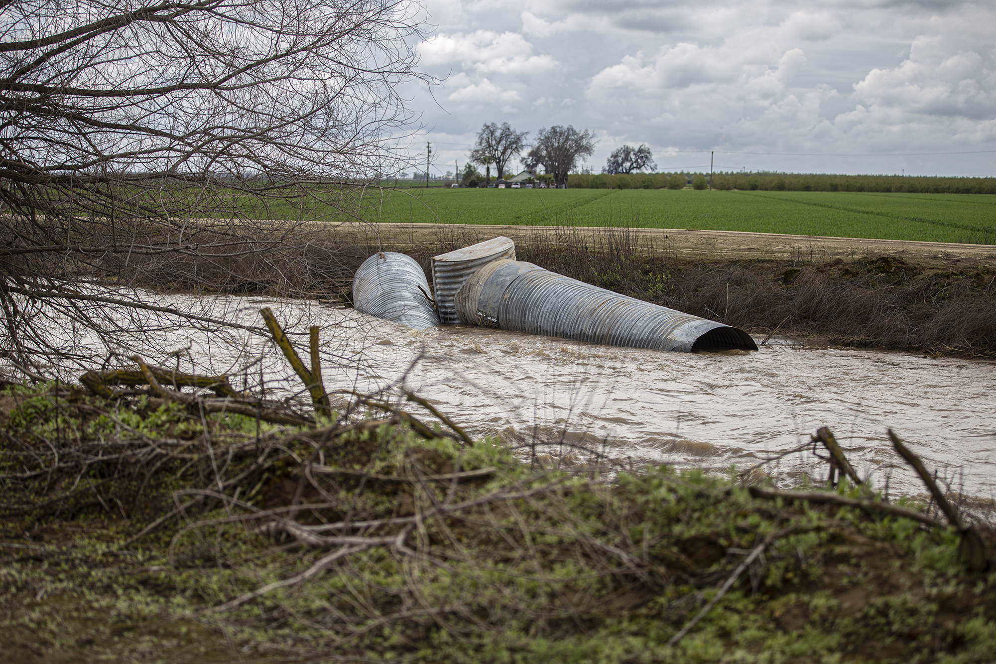 Pieces of canal drainage pipes that were swept away down the canal after a flood hit the area on March 23, 2023.