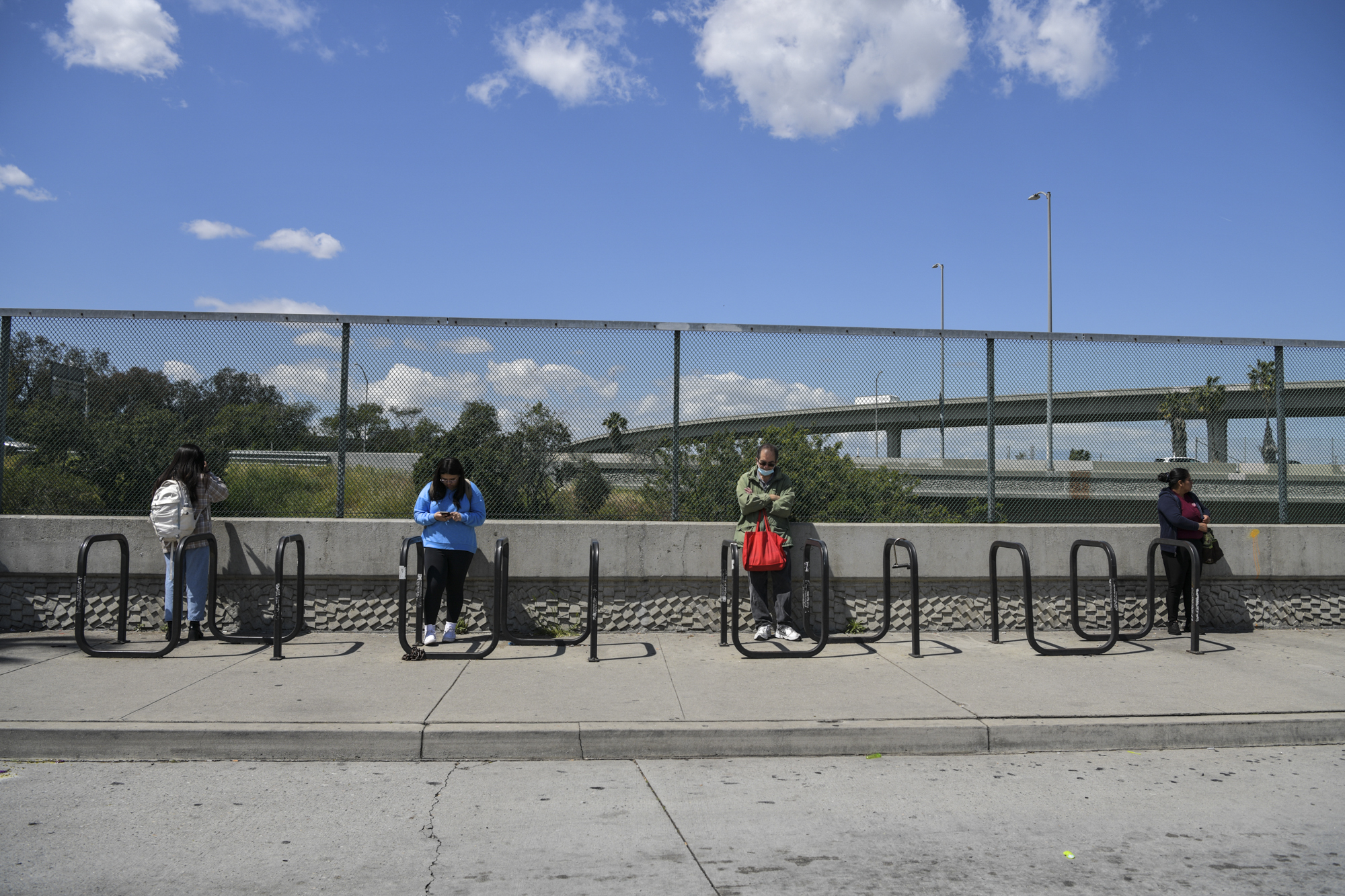 Commuters wait for buses to arrive at the Norwalk Green Line Station in Norwalk on April 3, 2023.