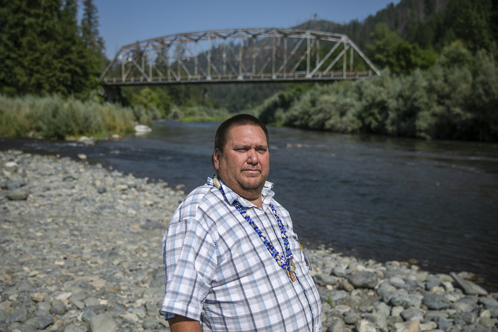 Aaron Hockaday looks out on the Klamath River in Happy Camp on Aug. 29, 2022. Photo by Martin do Nascimento, CalMatters