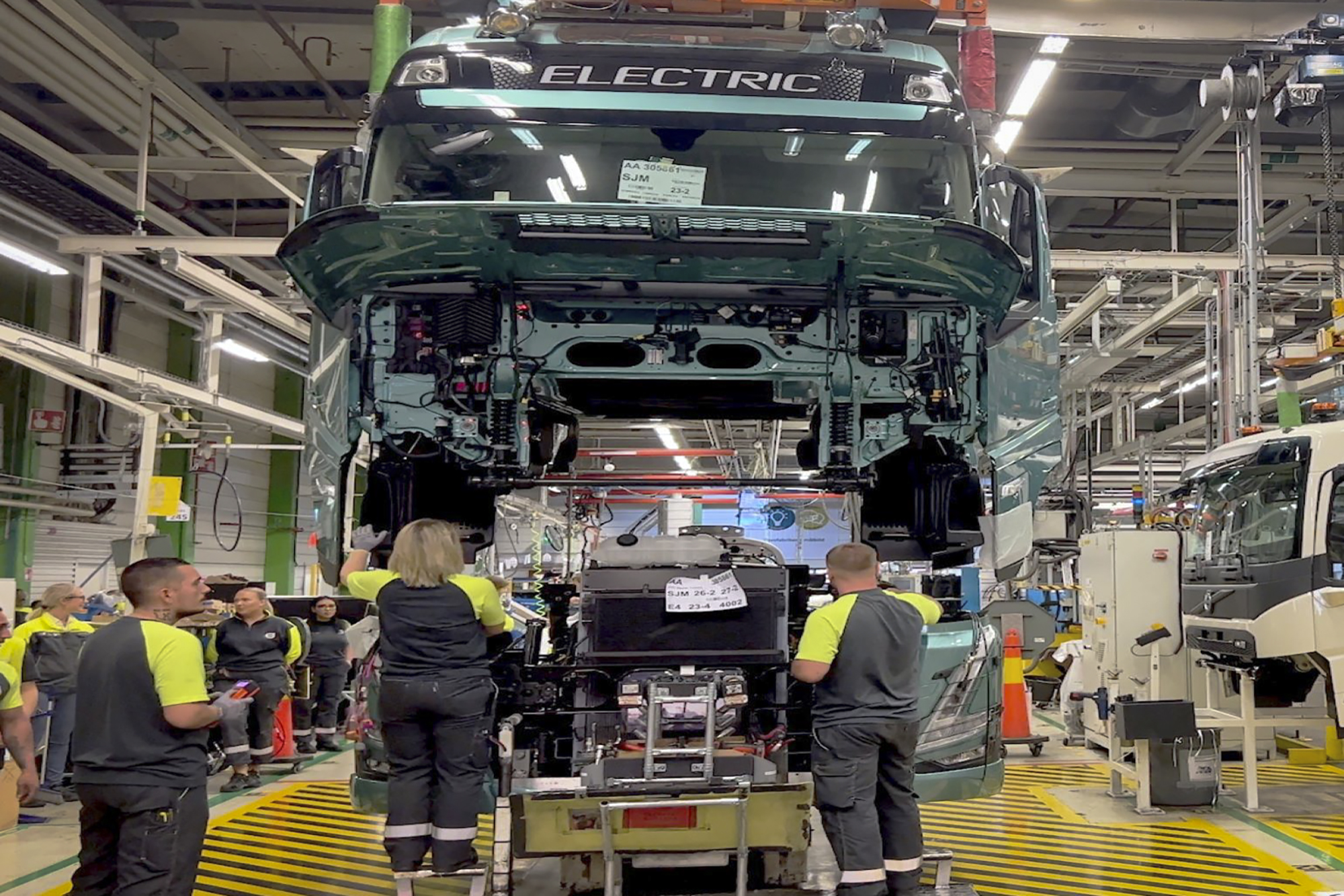 Workers at a Volvo Trucks' plant in Sweden assemble an electric truck. Photo courtesy of Volvo