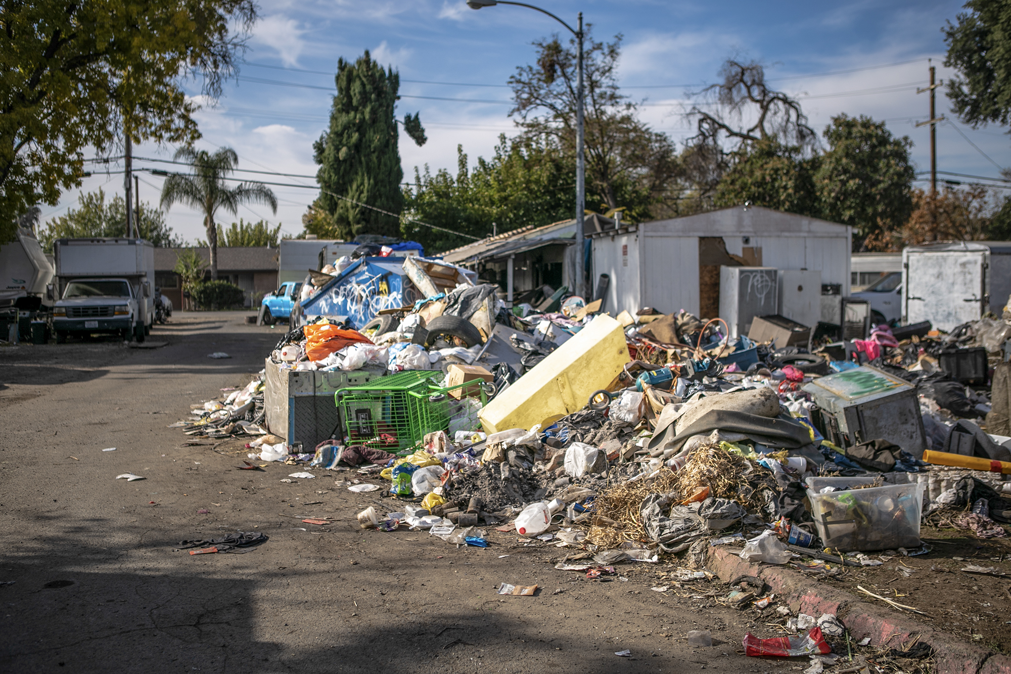 Garbage piles at Stockton Park Village in Stockton on Nov. 22, 2022. Photo by Rahul Lal, CalMatters.