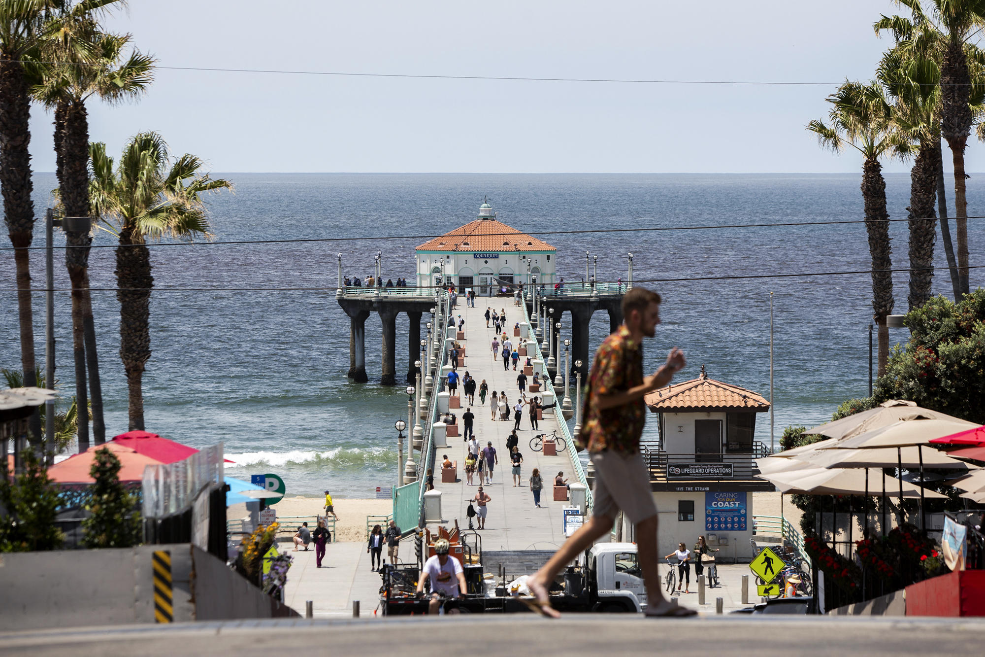 People make their way along the Manhattan Beach Pier in Manhattan Beach.