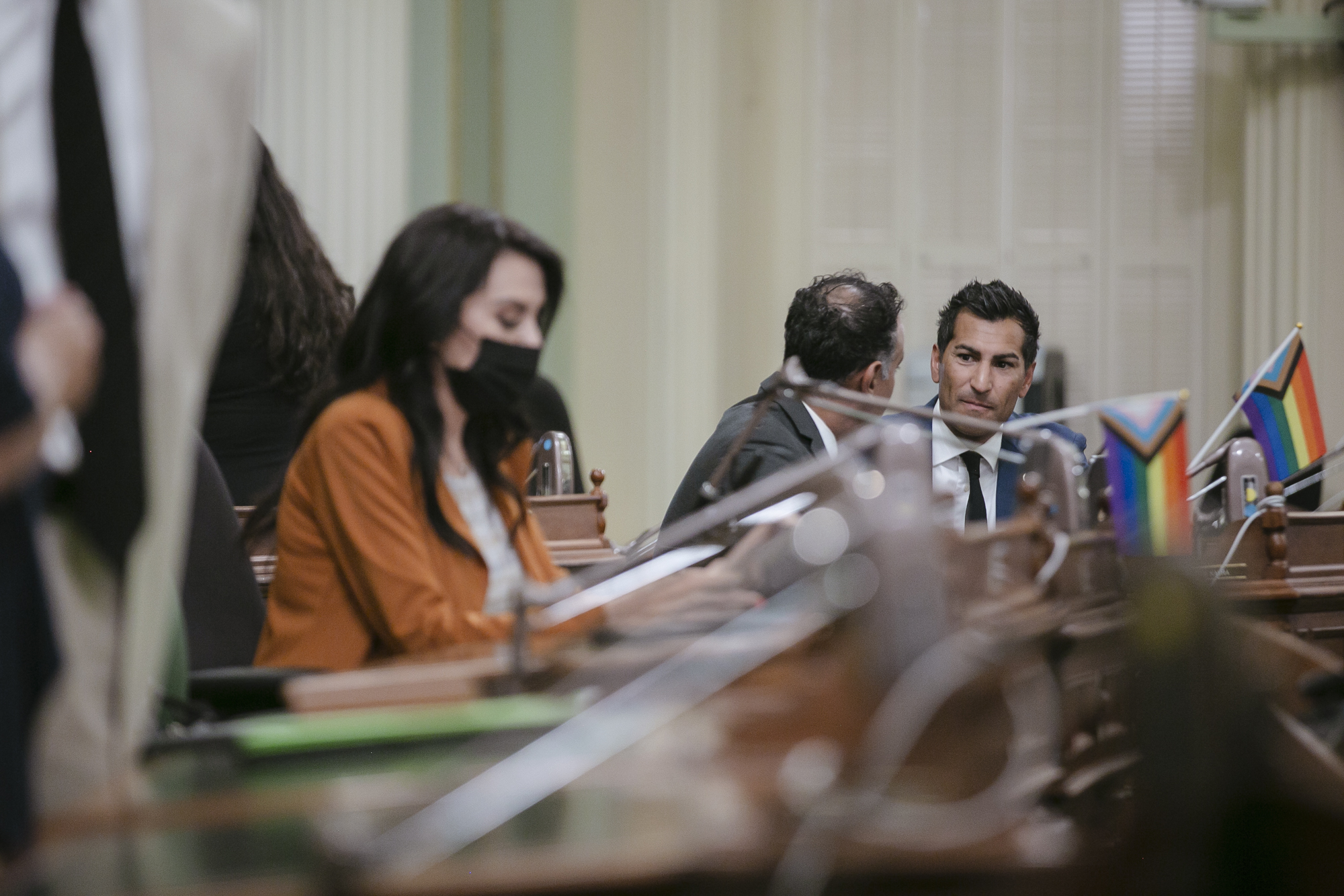 Assemblymember Robert Rivas talks to Assemblymember Ash Kalra during a floor session at the state Capitol in Sacramento on Monday, Aug. 1, 2022. Photo by Rahul Lal, CalMatters