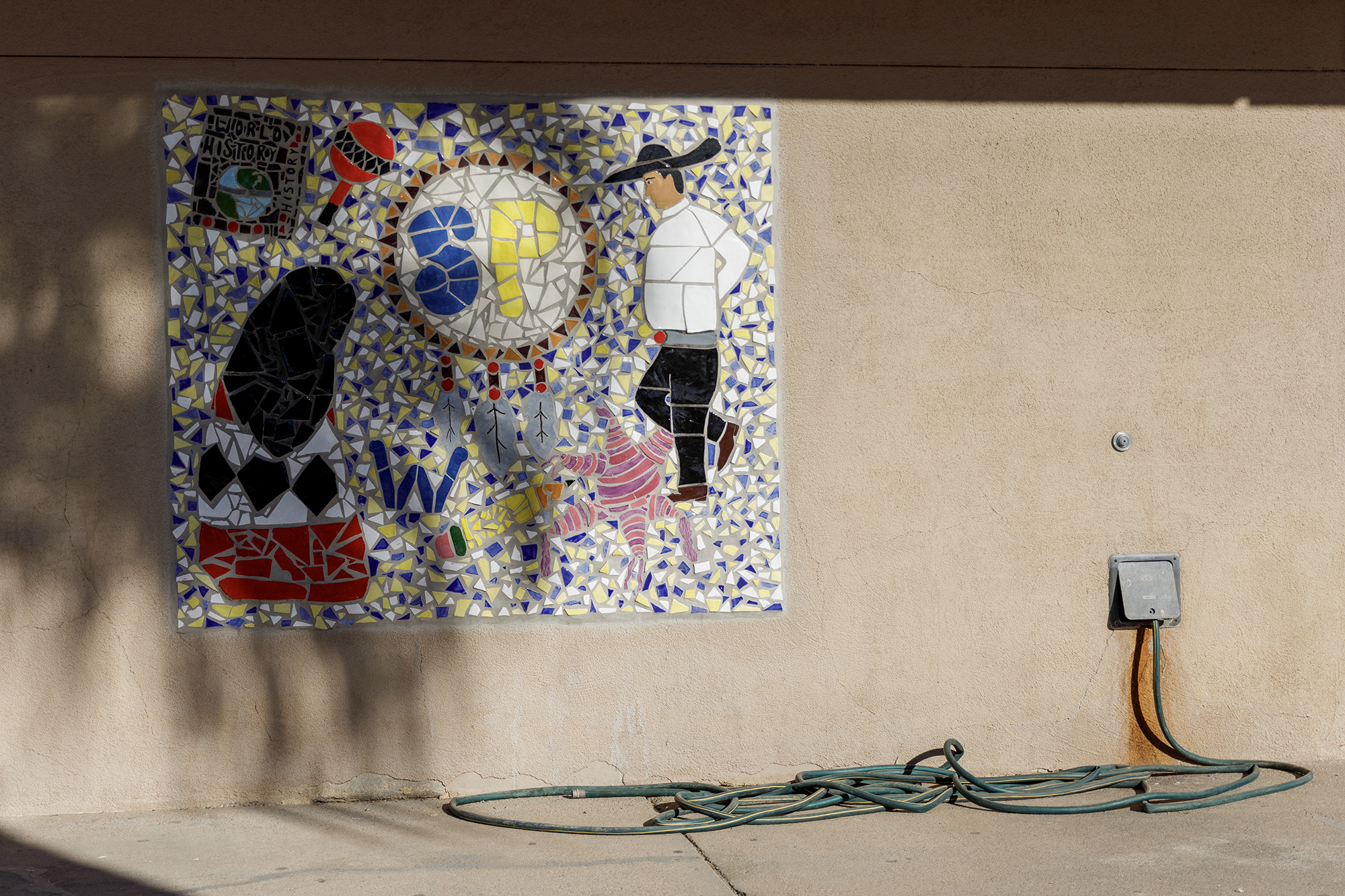 A mosaic with Hispanic and Native imagery is displayed at the high school campus of the San Pasqual Valley Unified School District at Winterhaven in Imperial County on Dec. 12, 2023. Photo by Kristian Carreon for CalMatters