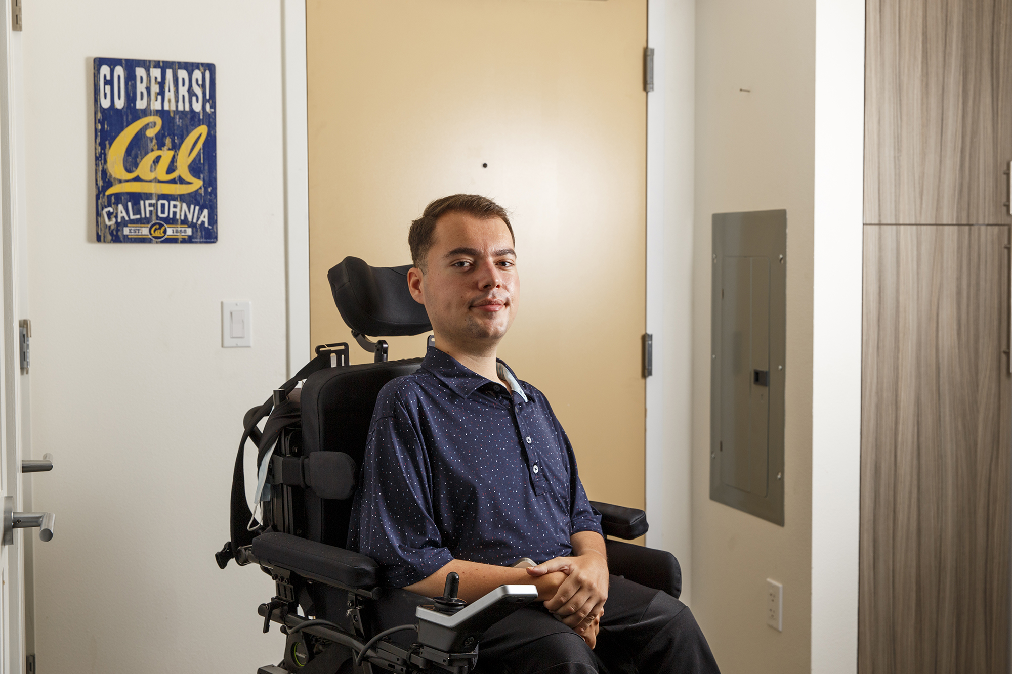 Ryan Manriquez in his apartment building at UC Berkeley on Jan. 10, 2024. Manriquez spoke about his experience with emergency exits as a person with disabilities at a recent UC Regents meeting, prompting the university system leadership to alter its emergency safety plans. Photo by Juliana Yamada for CalMatters