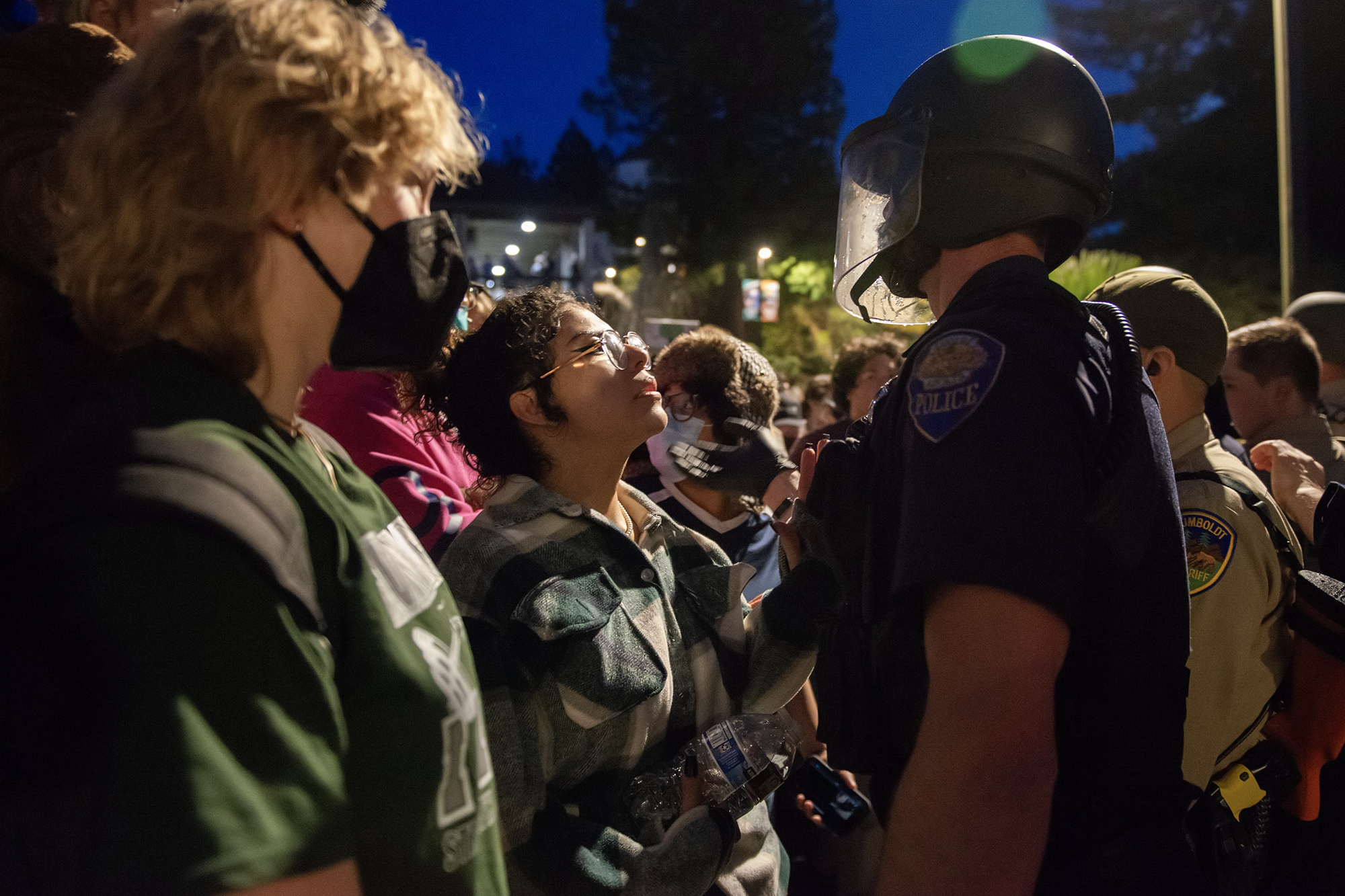 Pro-Palestinian protesters demand police officers go home during a protest outside of Siemens Hall at Cal Poly Humboldt in Arcata on April 22, 2024. Photo by Mark McKenna for CalMatters