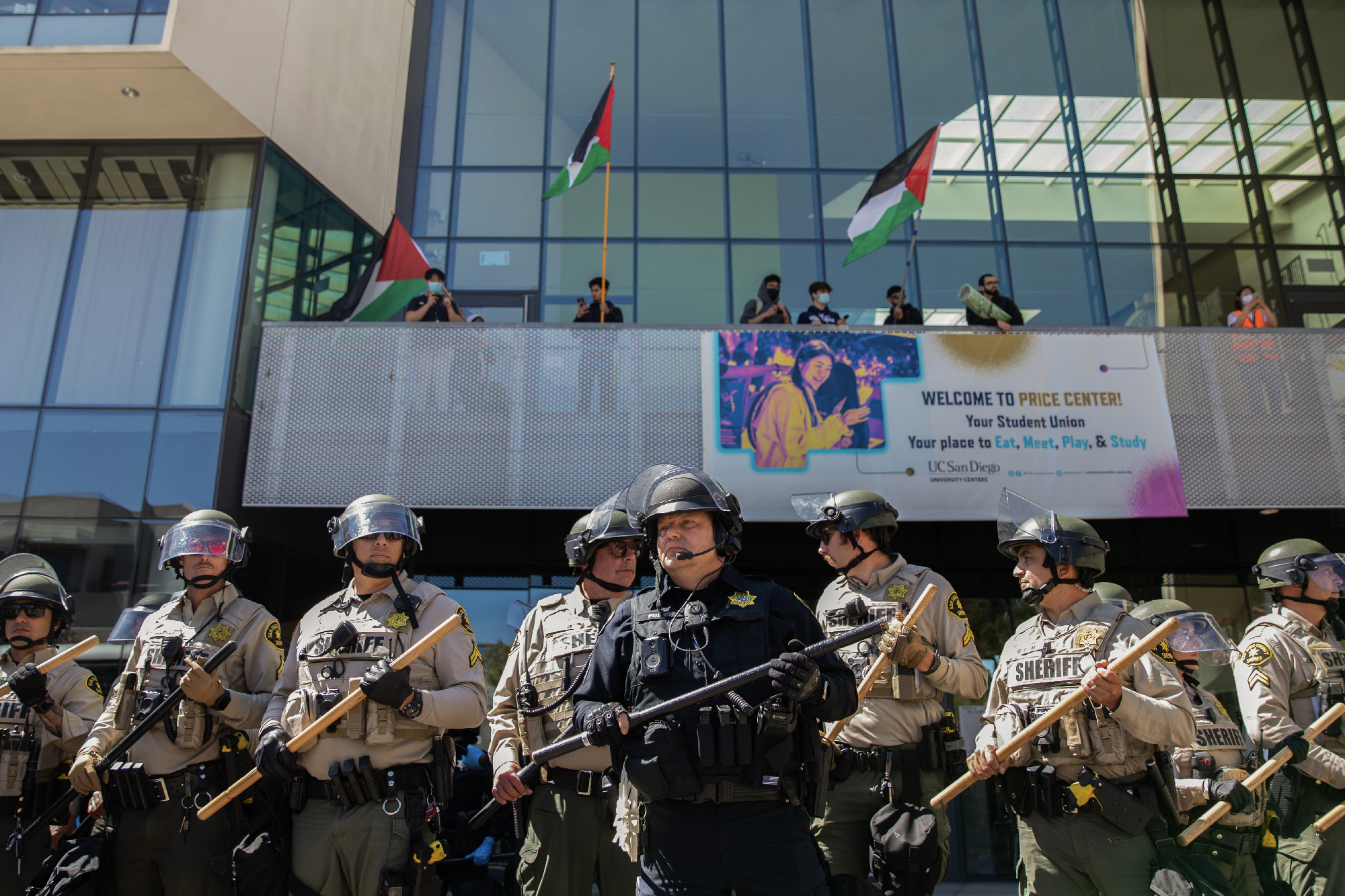 San Diego Sheriff's deputies and University of California campus officers stand guard at a pro-Palestinian protest at UC San Diego in San Diego on May 6, 2024. Photo by Adriana Heldiz, CalMatters