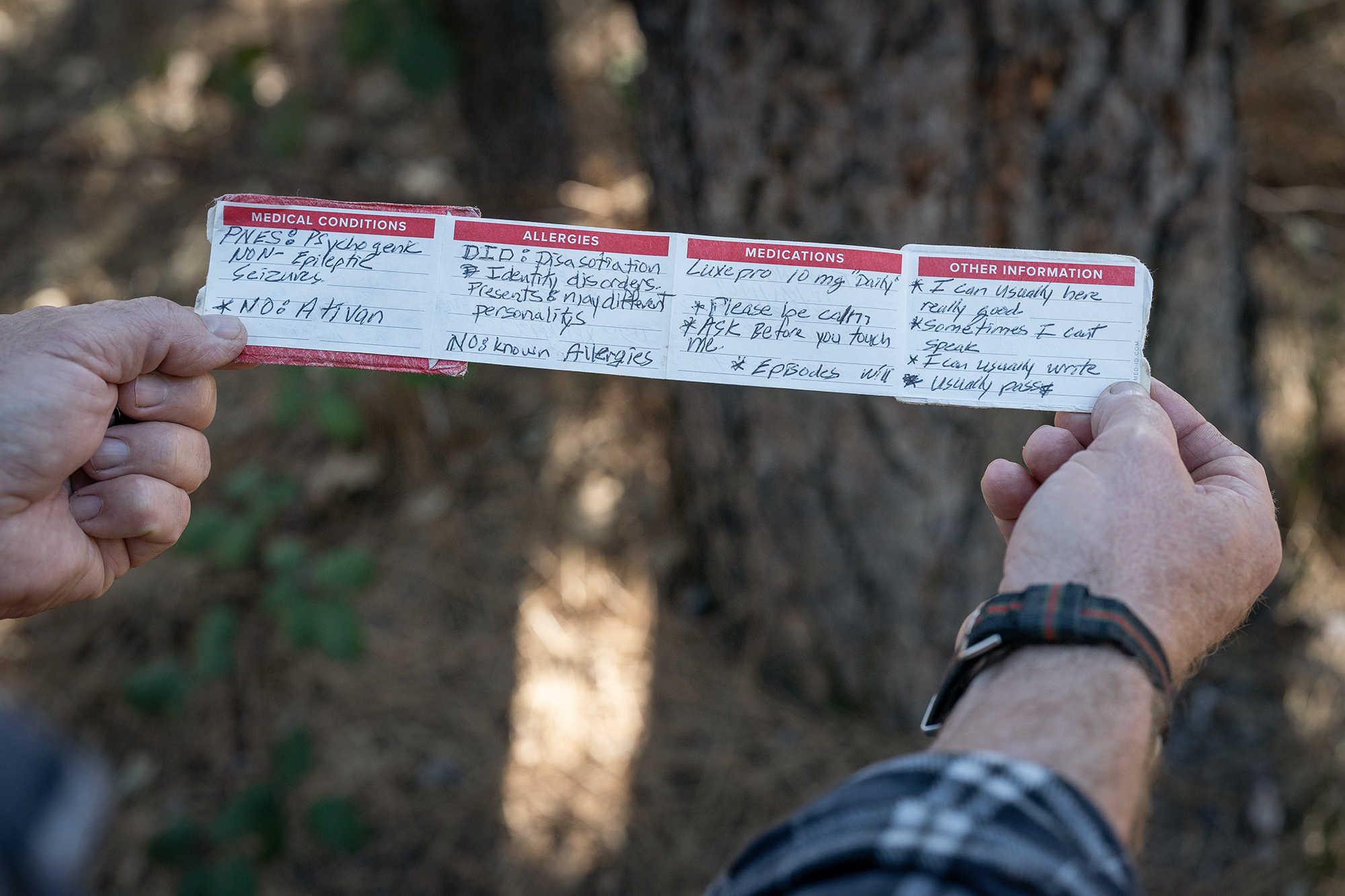 Retired CalFire firefighter Todd Nelson's emergency medical ID card that he carries with him. Nelson suffers from post-traumatic stress disorder resulting from trauma experienced during his firefighting career. Nevada City, March 19, 2024. Photo by Loren Elliott for CalMatters