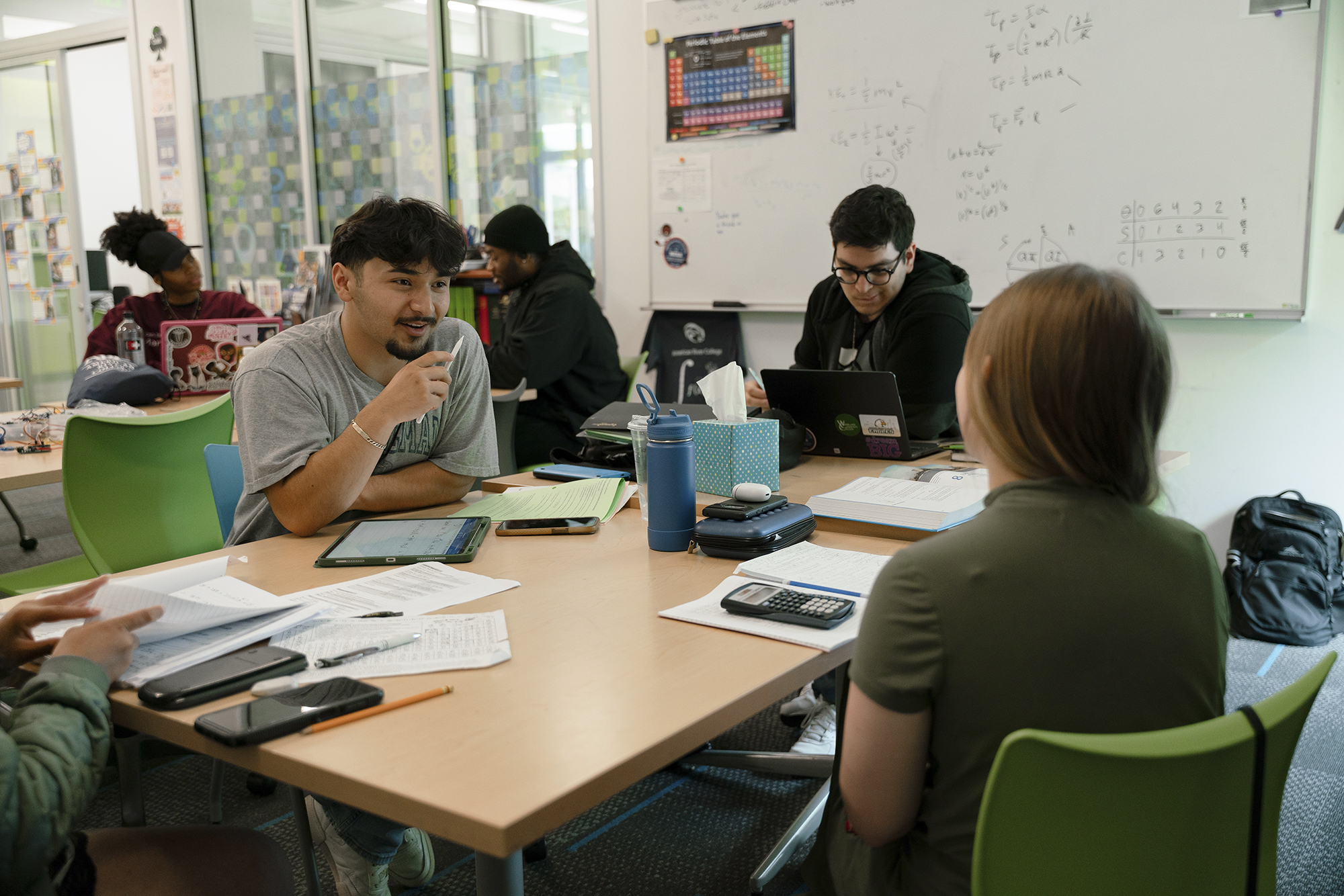 Students discuss their work in class at the MESA center at American River College on April 25, 2024. Photo by Cristian Gonzalez for CalMatters