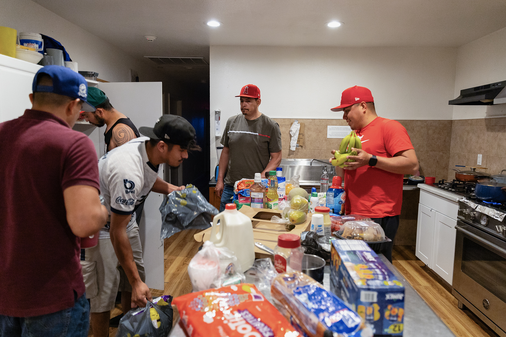 Workers at the Balletto Vineyard store their groceries for the week at the farmworker house in Santa Rosa on May 9, 2024. Photo by Manuel Orbegozo for CalMatters