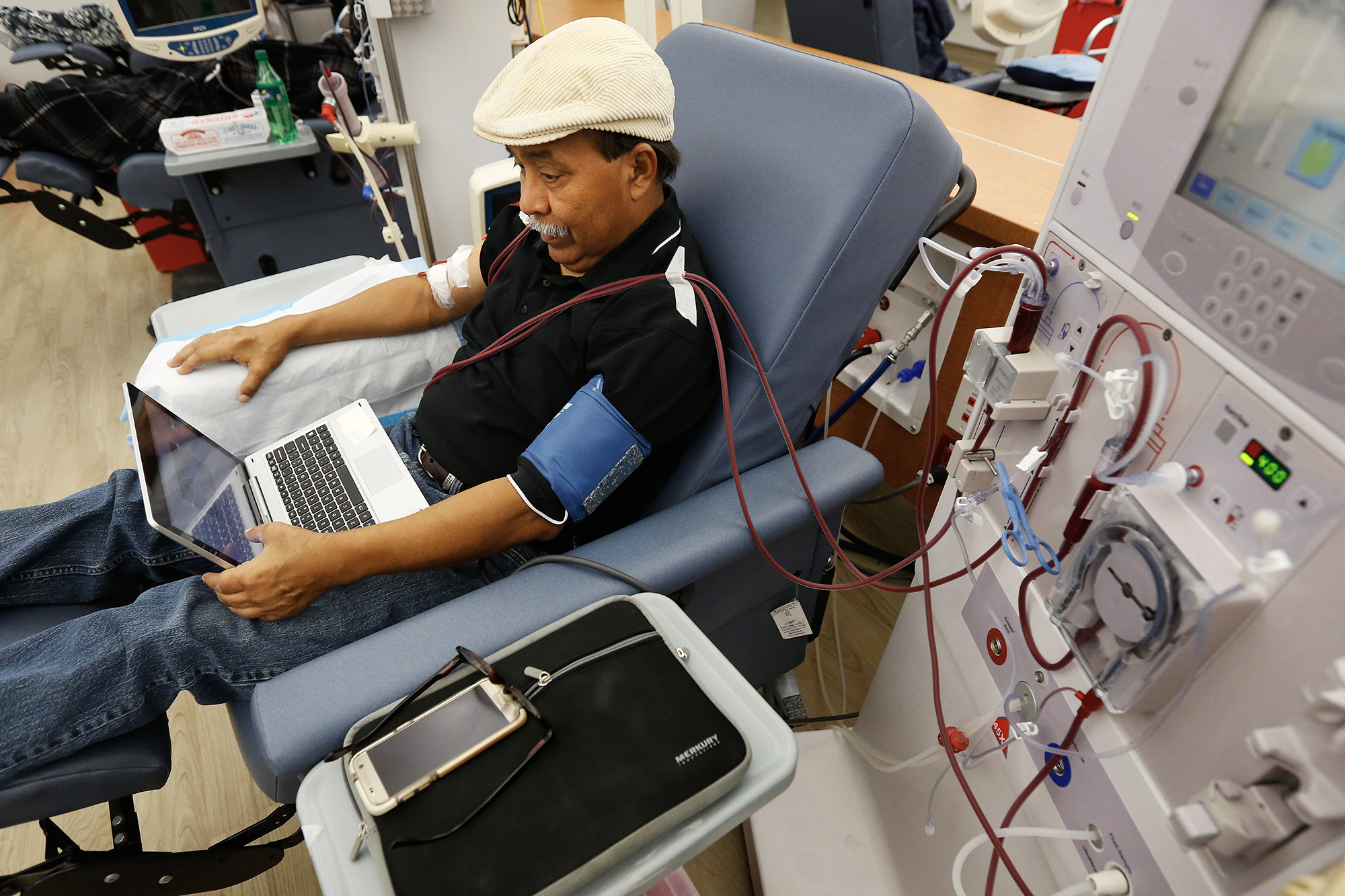 A patient undergoes dialysis at a DaVita Kidney Care clinic in Sacramento in 2018. Photo by Rich Pedroncelli, AP Photo