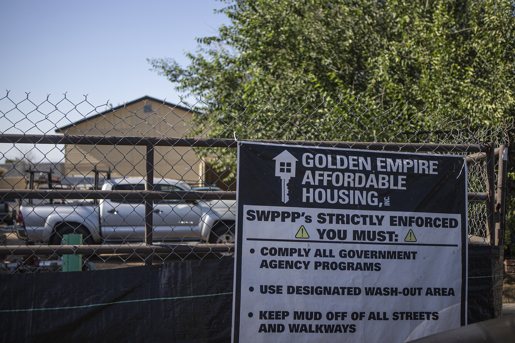 A sign for a construction site for Golden Empire Affordable Housing in Bakersfield on May 29, 2024. Photo by Larry Valenzuela, CalMatters/CatchLight Local