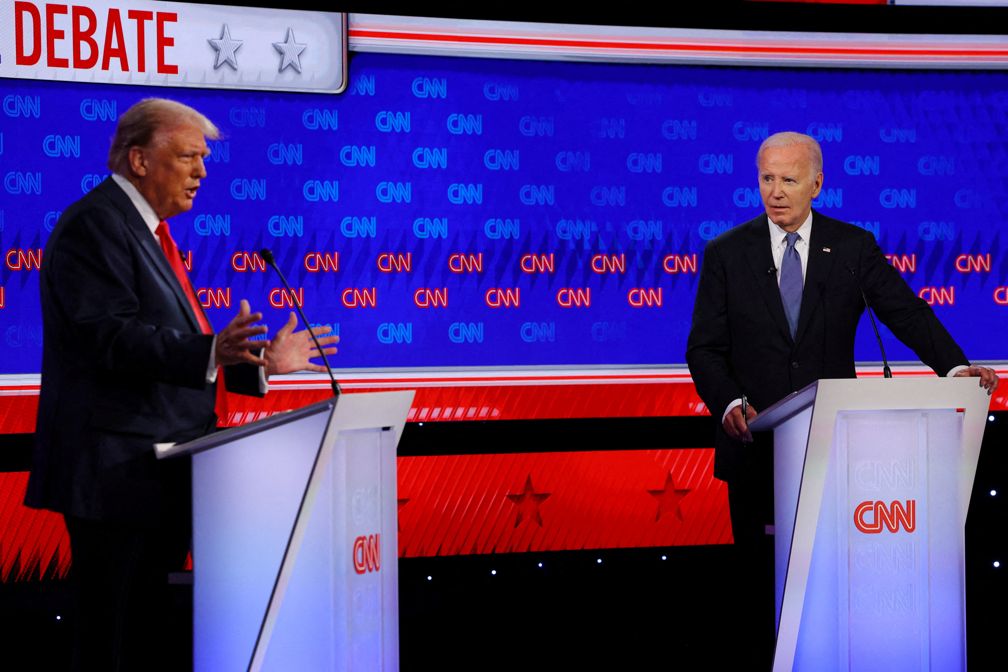 Democrat presidential candidate U.S. President Joe Biden listens as Republican presidential candidate and former U.S. President Donald Trump speaks during their debate in Atlanta, Georgia, on June 27, 2024. Photo by Brian Snyder via Reuters