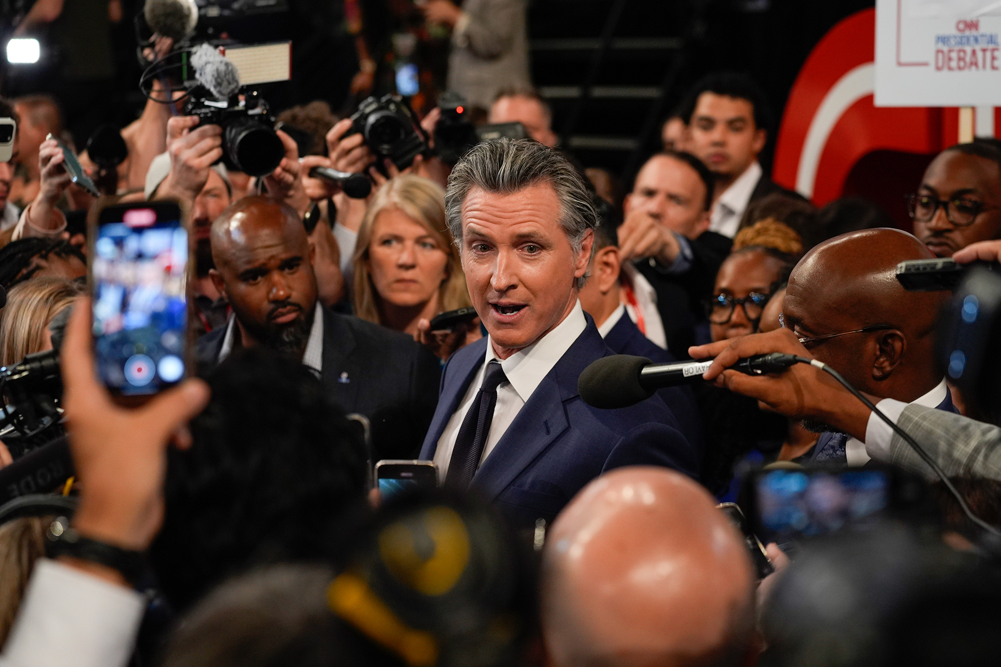 Gov. Gavin Newsom speaks to reporters in the spin room after a presidential debate between President Joe Biden and Republican presidential candidate former President Donald Trump in Atlanta on June 27, 2024. Photo by John Bazemore, AP Photo