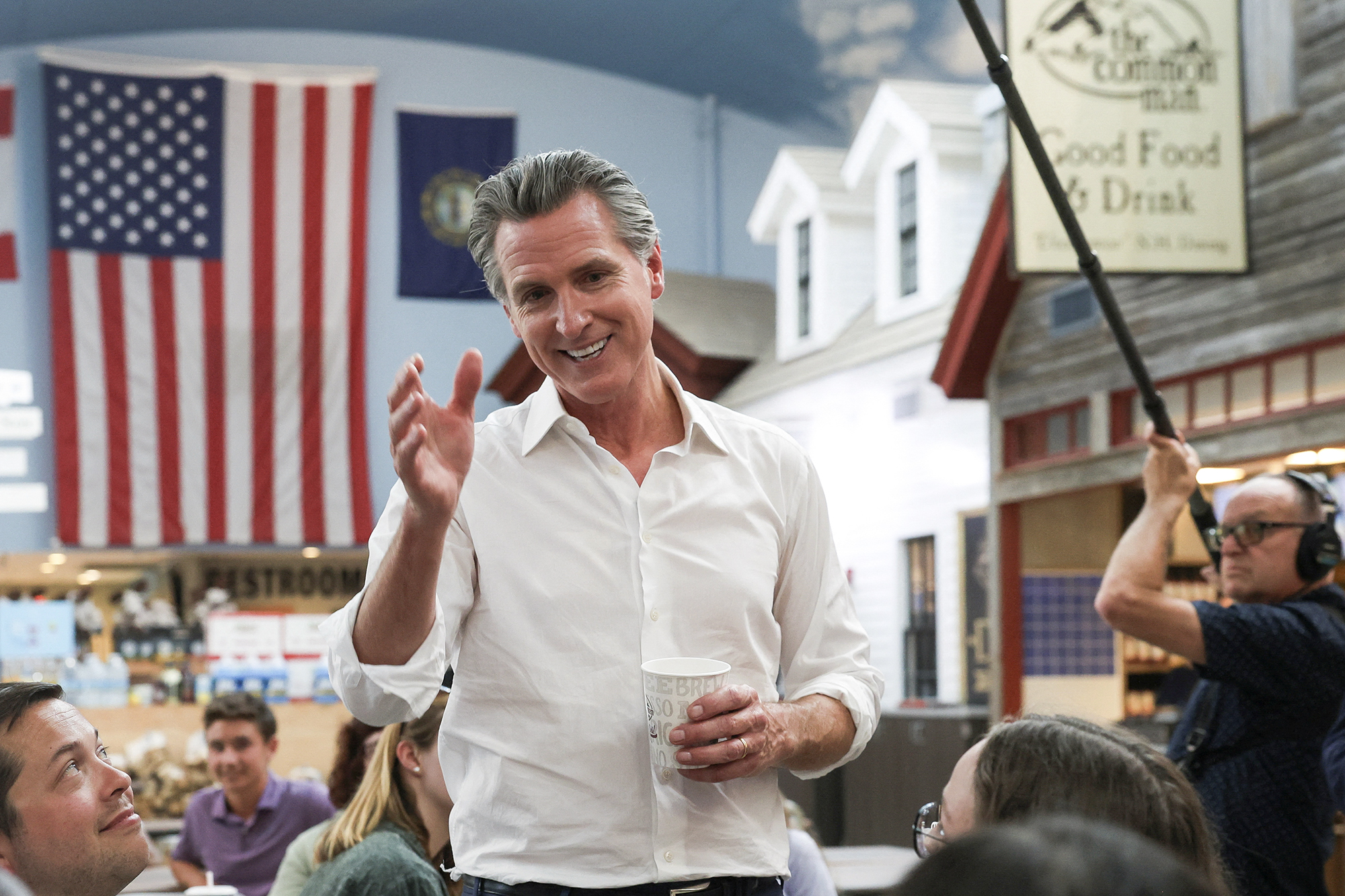 Gov. Gavin Newsom, who is in New Hampshire to attend a fundraising event for U.S. President Joe Biden's campaign, greets people at the Common Man Roadside Cafe & Deli in Hooksett, New Hampshire, on July 8, 2024. Photo by Reba Saldanha, Reuters