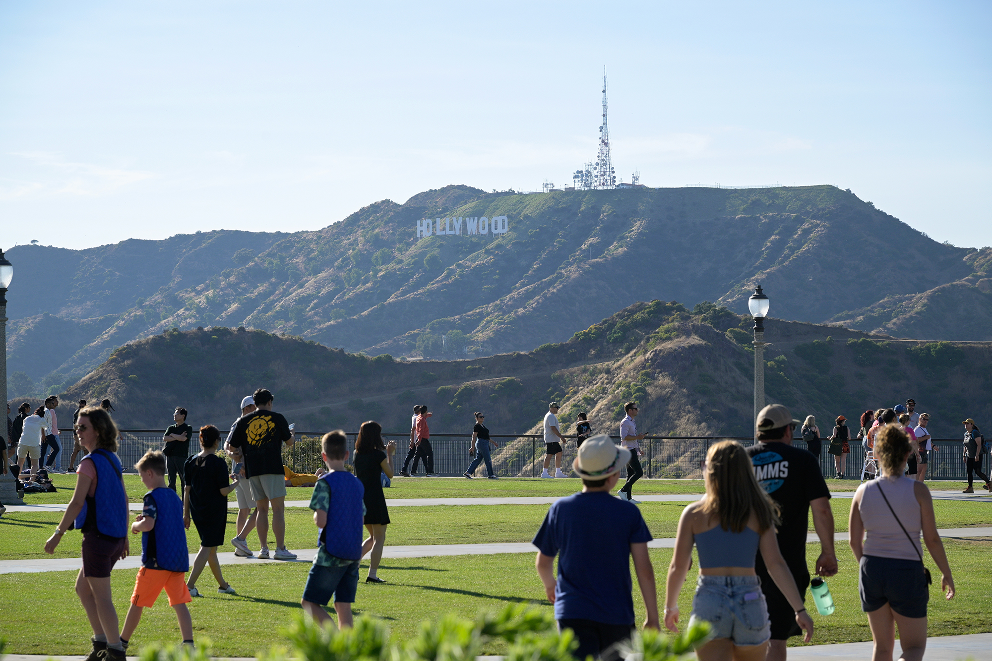 People visit the Griffith Observatory with the Hollywood sign in the background in Los Angeles on July 13, 2023. Photo by Phelan M. Ebenhack via AP