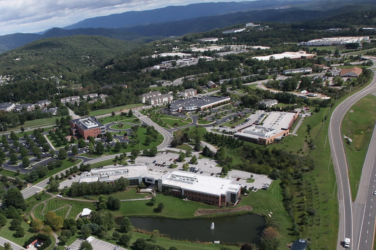 An aerial view of the Virginia Tech Corporate Research Center, a campus of brick buildings.