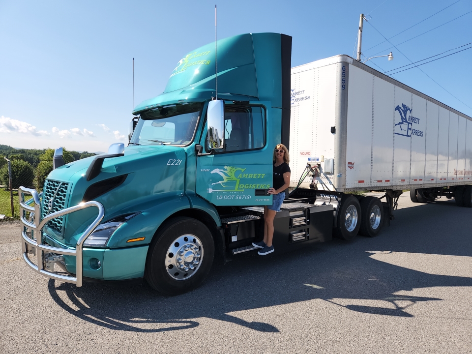 Driver Becky Fields with Camrett's Volvo VNR Electric.