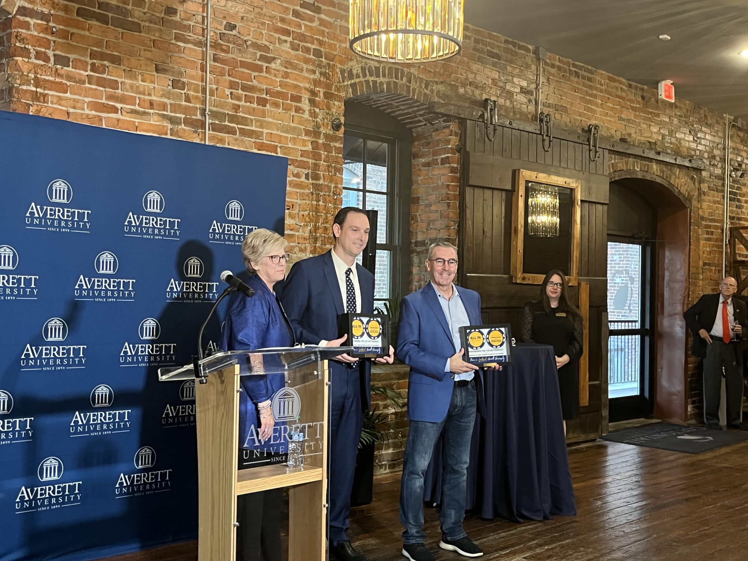 Averett University President Tiffany Franks, Caesars Virginia General Manager Chris Albrecht and Caesars Senior Vice President of Development Robert Livingston. Photo by Grace Mamon.