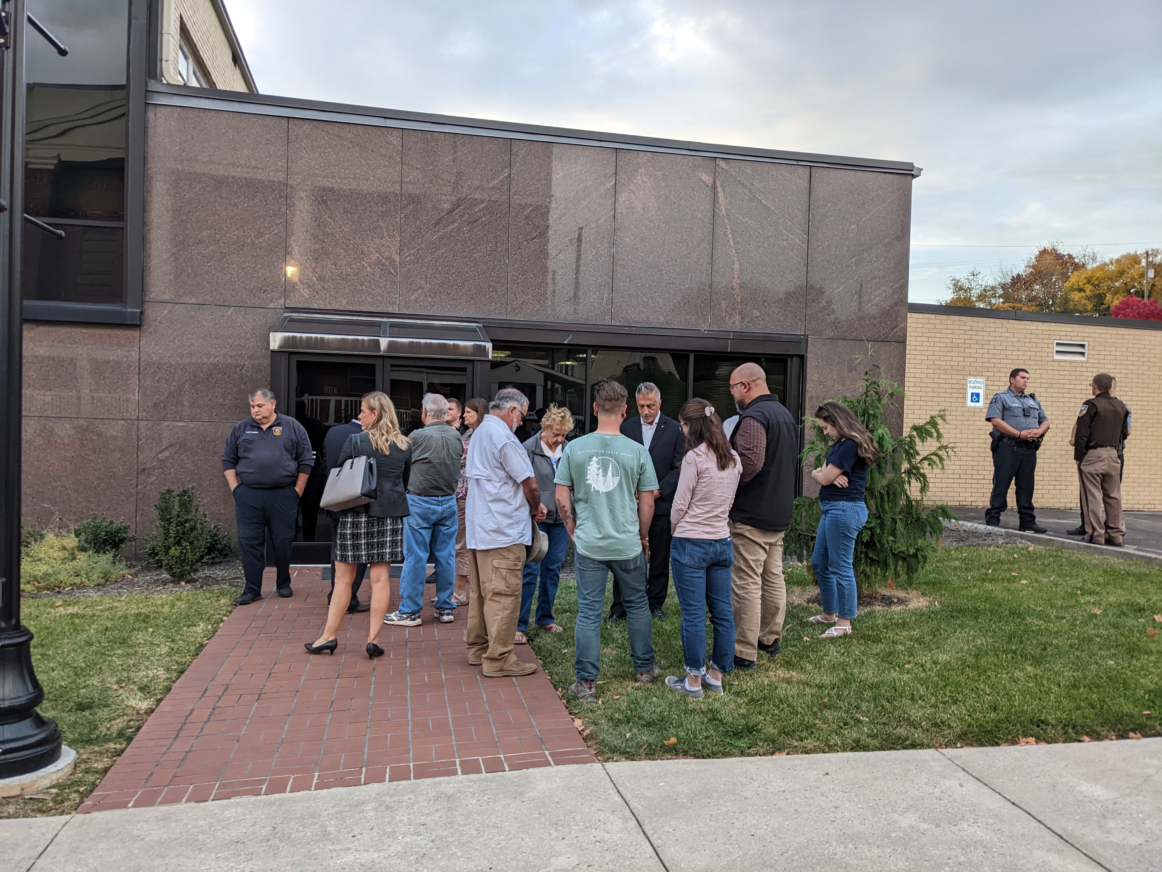 A prayer circle took shape on the front lawn of Bristol City Hall, while the city council met inside to talk about abortion clinic restrictions. Photo by Megan Schnabel.