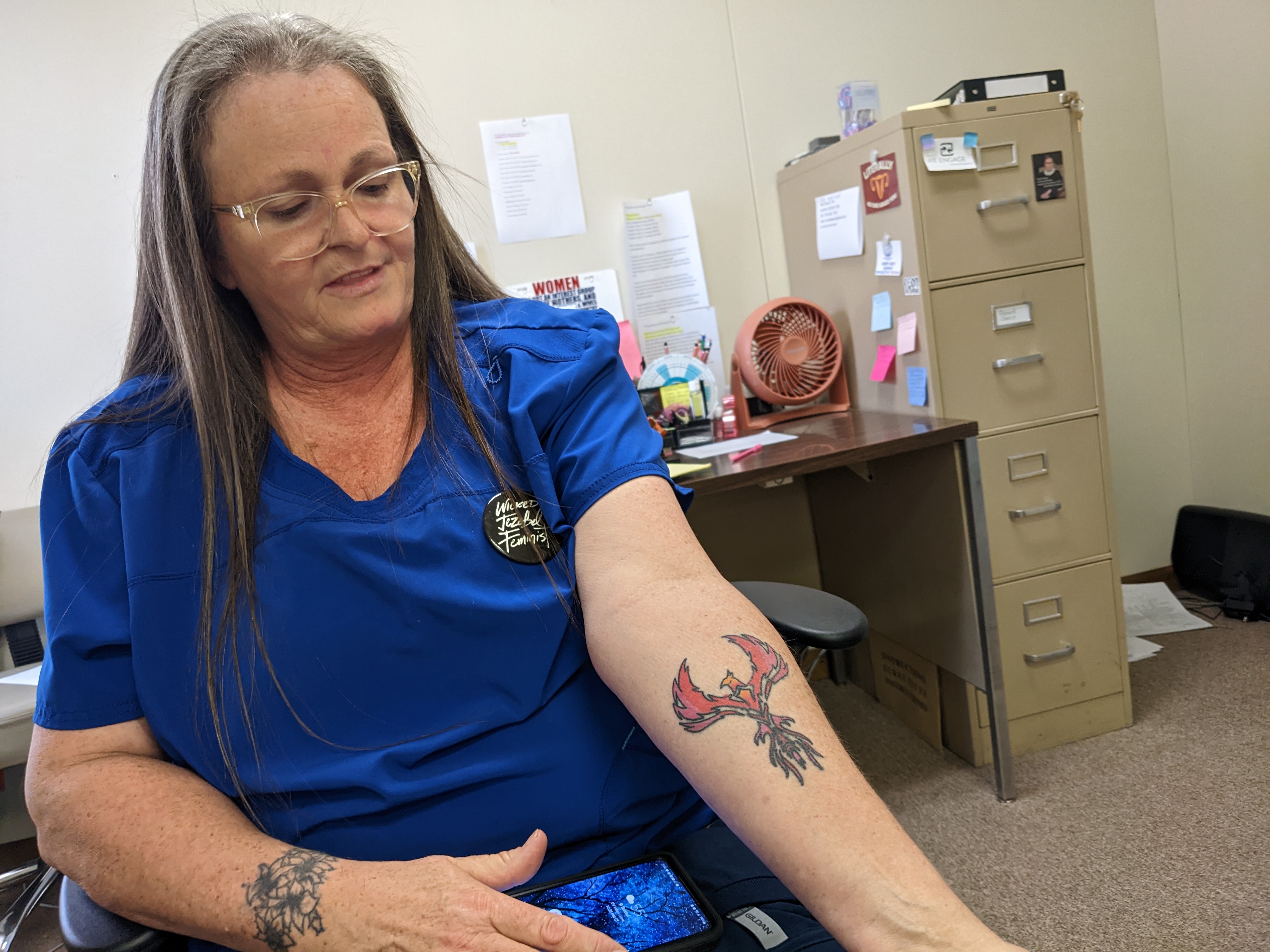 Stephanie Rosenwinge, who works at Bristol Women's Health, got this tattoo over the summer in Nashville, when she was part of a counter-protest against Operation Save America, an anti-abortion group. She lives in Tennessee, which has a near-total ban on abortions, and she wonders if she could get in trouble for helping provide abortions to Tennessee residents. But she says she's not worried: “Make me your martyr,” she said. “My kids are grown. You want to take me to court? Have at it. I got nothing to lose. I am so passionate about this. This is so important to me."Photo by Megan Schnabel.
