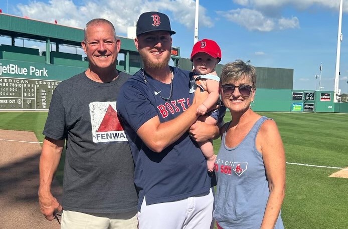 Zack Kelly and his son, Kayden, with his parents at spring training. His father, Reed Kelly, is the former sheriff of Botetourt County. Courtesy of Kelly