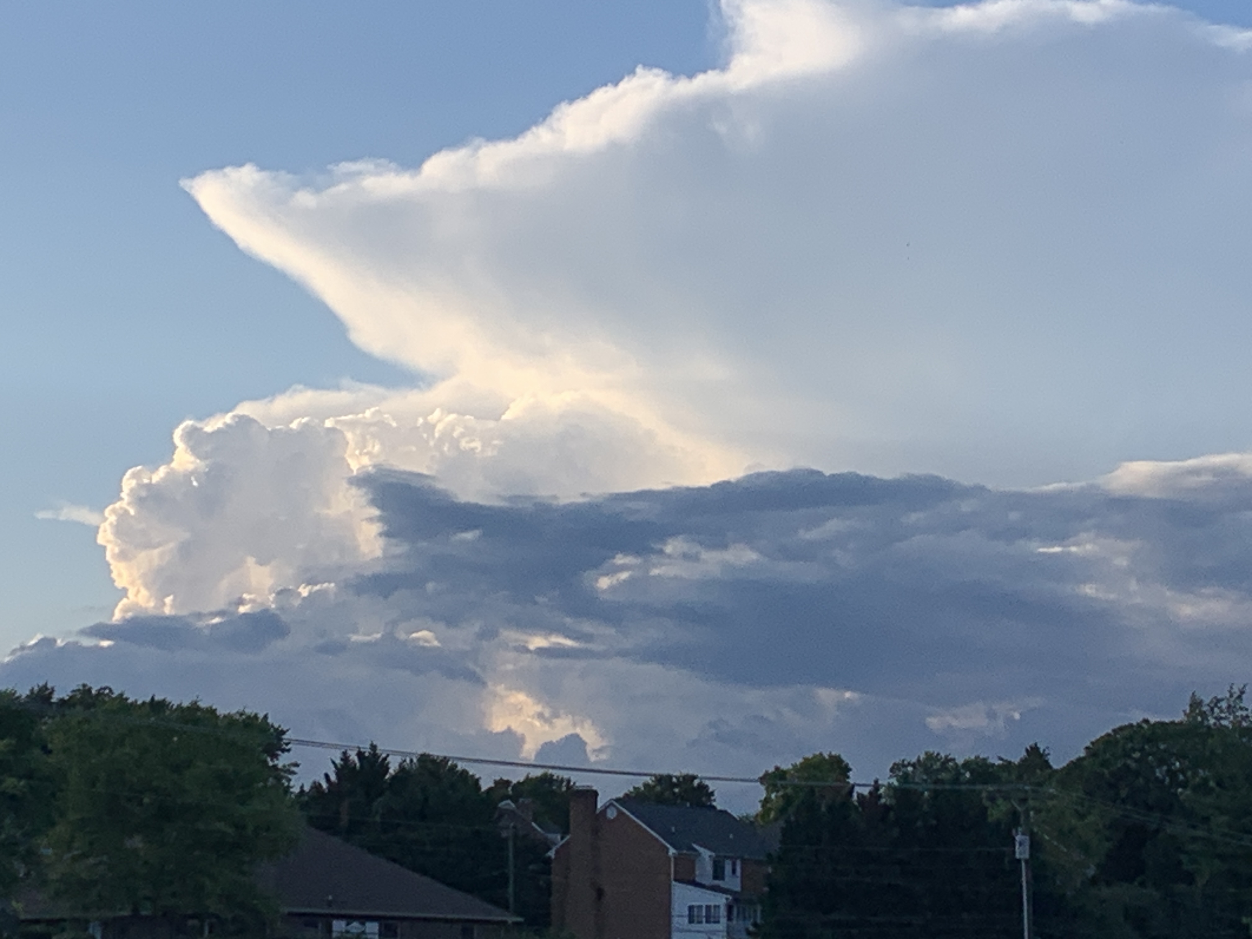 A sharp cirrus anvil appears with thunderstorm updrafts over Botetourt County as seen from Cave Spring in southwest Roanoke County, on Monday, June 26. Photo by Kevin Myatt.