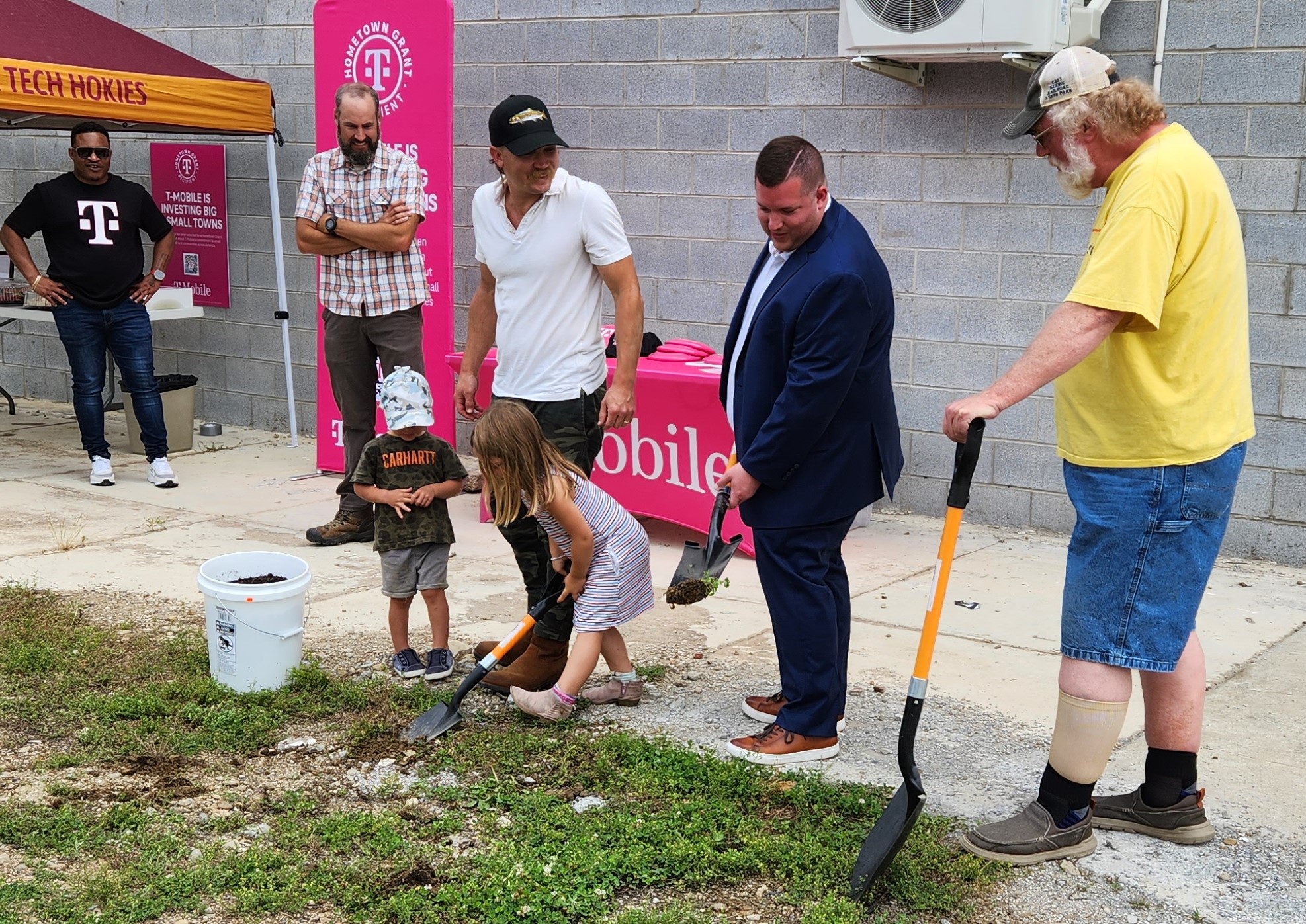 The groundbreaking for the Craig County Farmers Market. From left: A T-Mobile representative Mac Hobbs, Craig County Supervisor Jason Matyas, farmer Ty Walker, Economic Development Authority chairman Jordan Labiosa and New Castle Town Member Ed Lee. The two children are Gratton Walker, age 3, and Eve Walker, age 5. Photo by Dwayne Yancey.