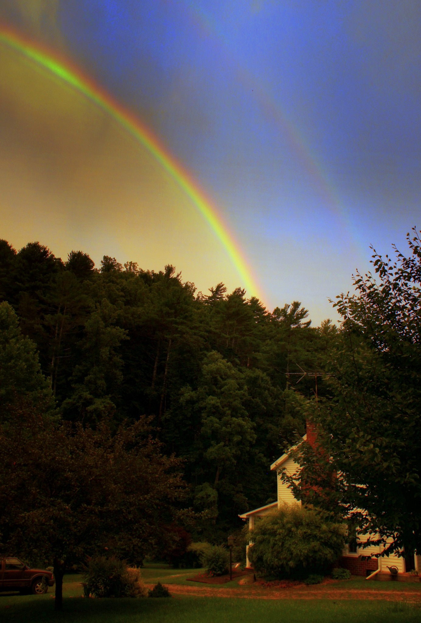 A double-rainbow lights up the early evening sky over Willis Hollow in eastern Montgomery County on Saturday evening, July 29. Courtesy of David Gravell.